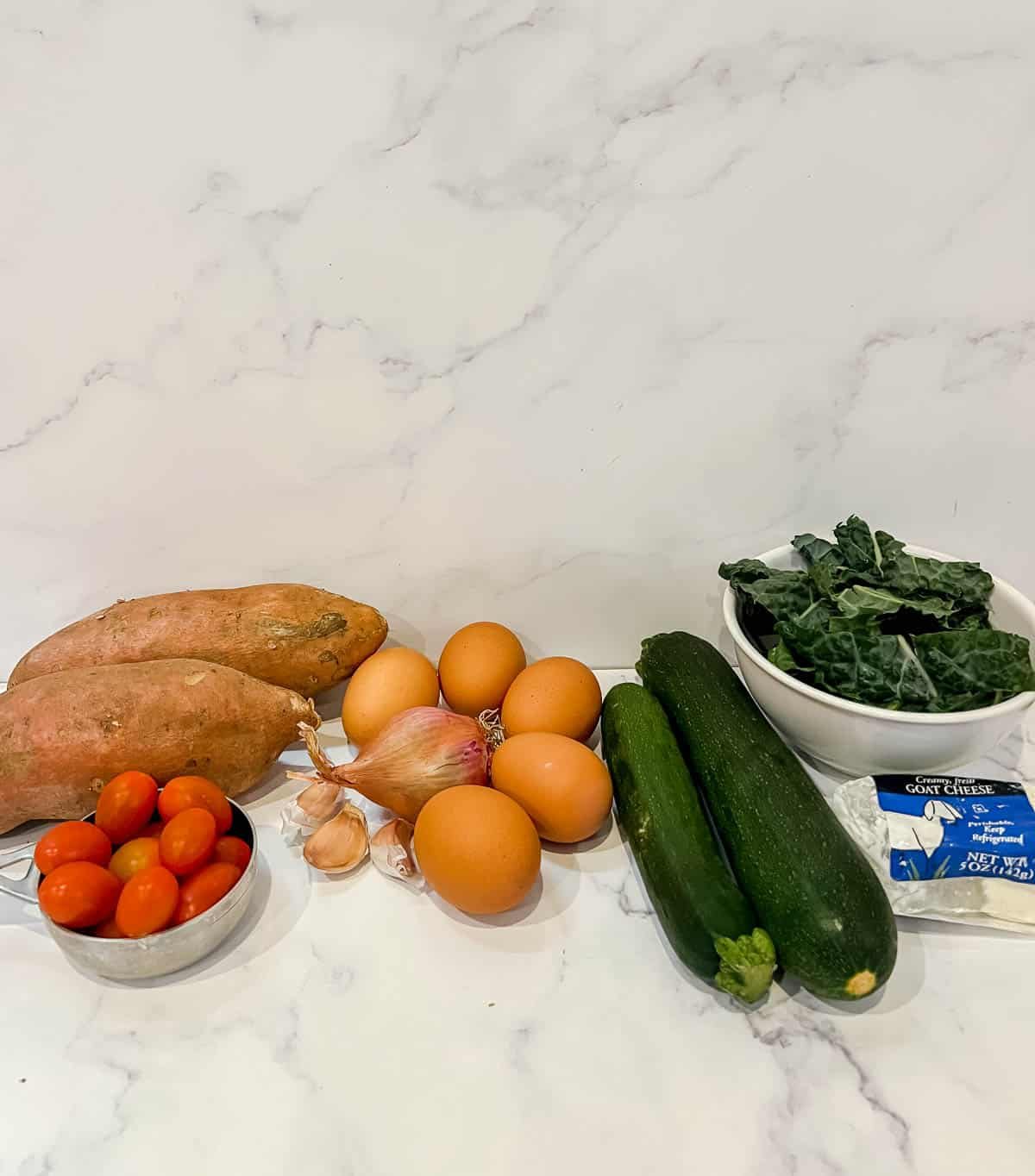 Ingredients needed to make Zucchini and Kale Sweet Potato Crust Quiche.