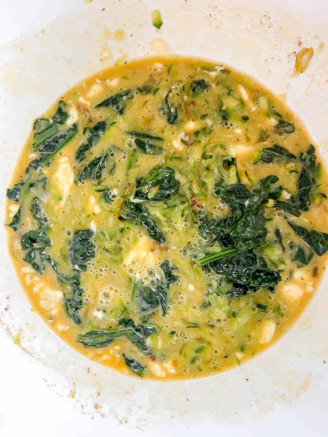 Quiche egg mixture with kale and zucchini added.