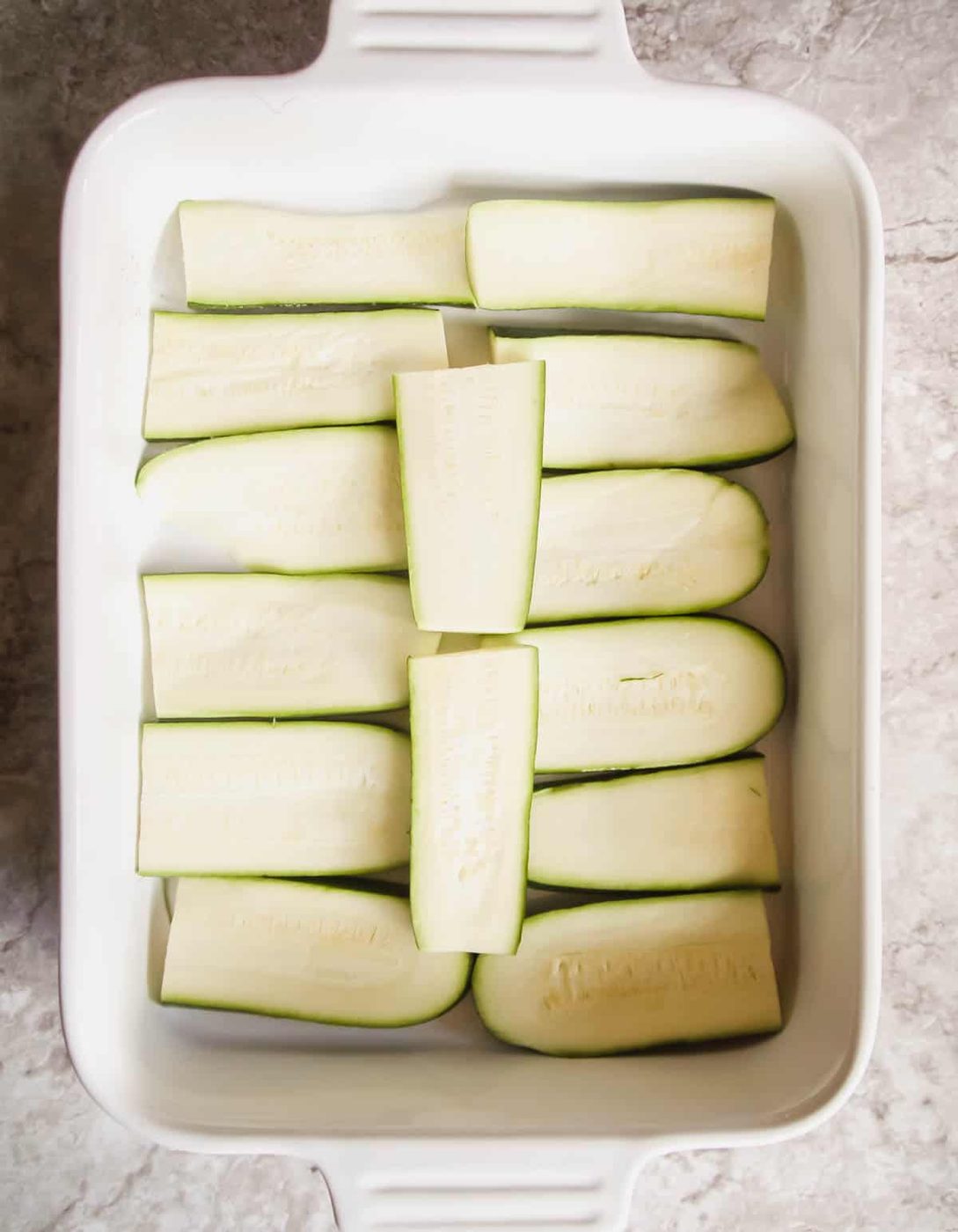 Sliced zucchini in a pan.