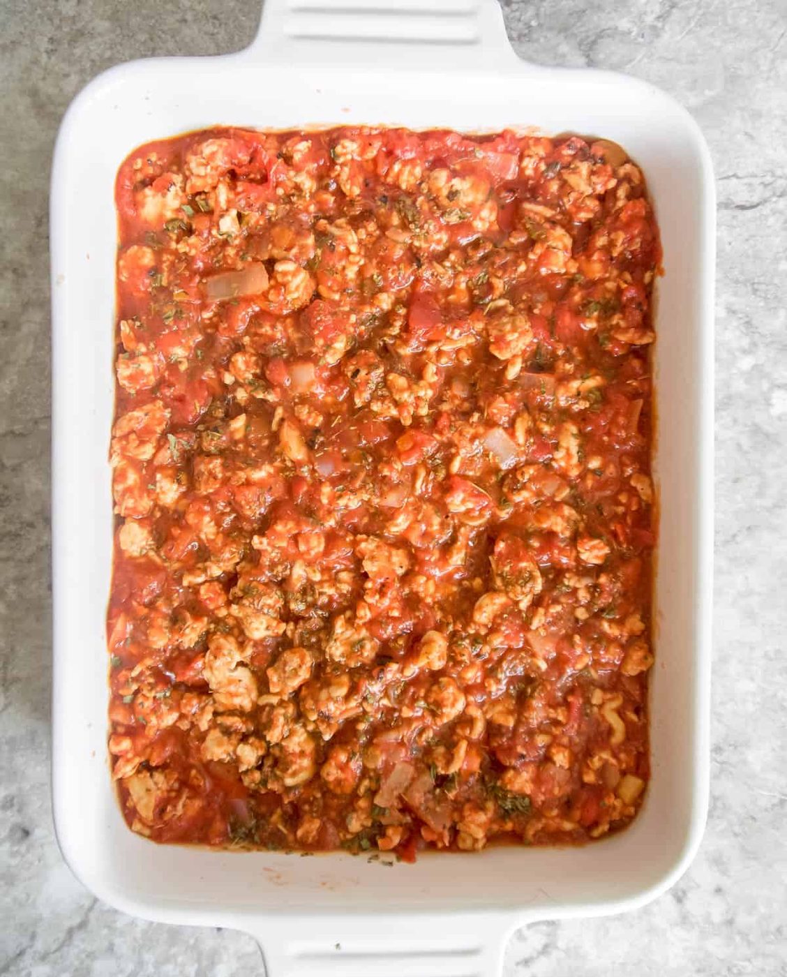 A layer of meat sauce on top.