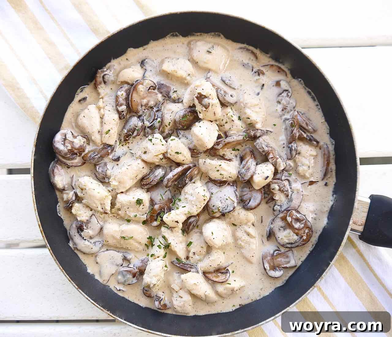 Wholesome Chicken, Mushroom and Spiral Potato Bake 6 Cooked chicken, minced onion, and garlic blending together in a pan, forming the aromatic base for the casserole sauce.