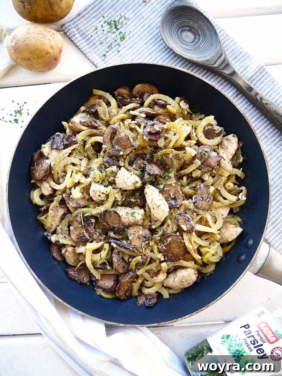 Wholesome Chicken, Mushroom and Spiral Potato Bake 7 The finished Whole30 and Paleo potato mushroom casserole, brimming with creamy chicken and spiralized potatoes, ready to be served.