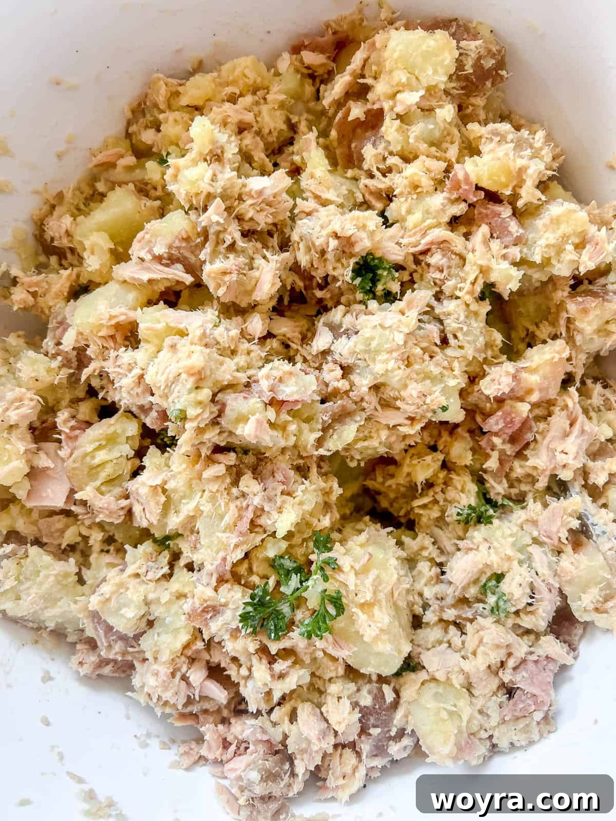 Paleo Whole30 French Tuna Potato Salad 9 All ingredients of the tuna and potato salad mixed together in a large bowl, ready for serving.