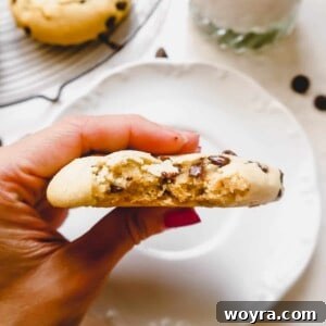 A bite taken out of a soft gluten free chocolate chip cookie.