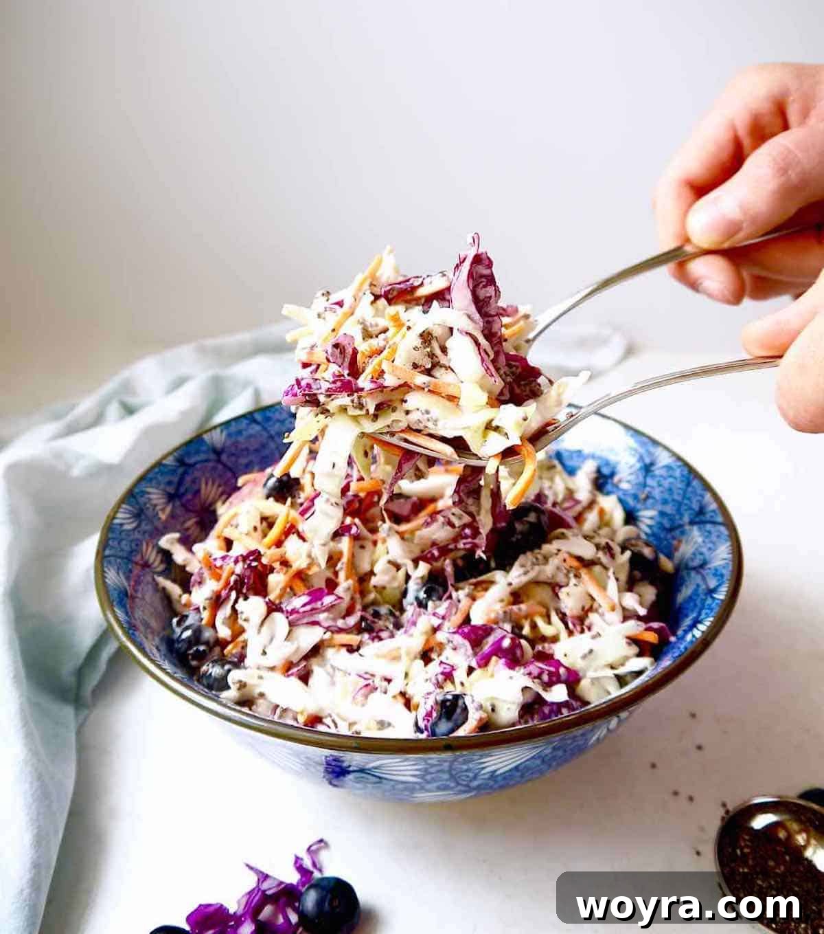 Wholesome Blueberry Chia Coleslaw Paleo and Dairy-Free 8 Light coleslaw recipe being served with silverware.