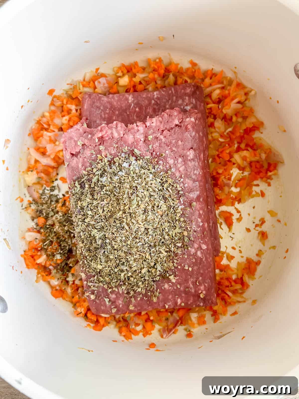 Wild Bison Ragu 5 Bison and Italian seasoning on top of minced carrots, onions and garlic.