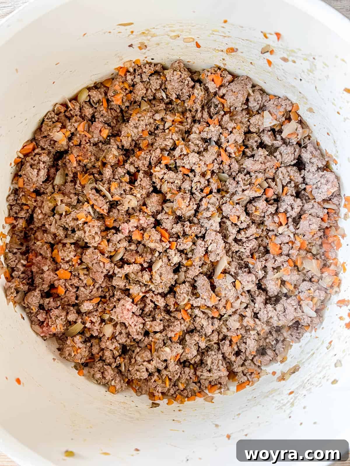 Wild Bison Ragu 7 Browned bison in a pan.