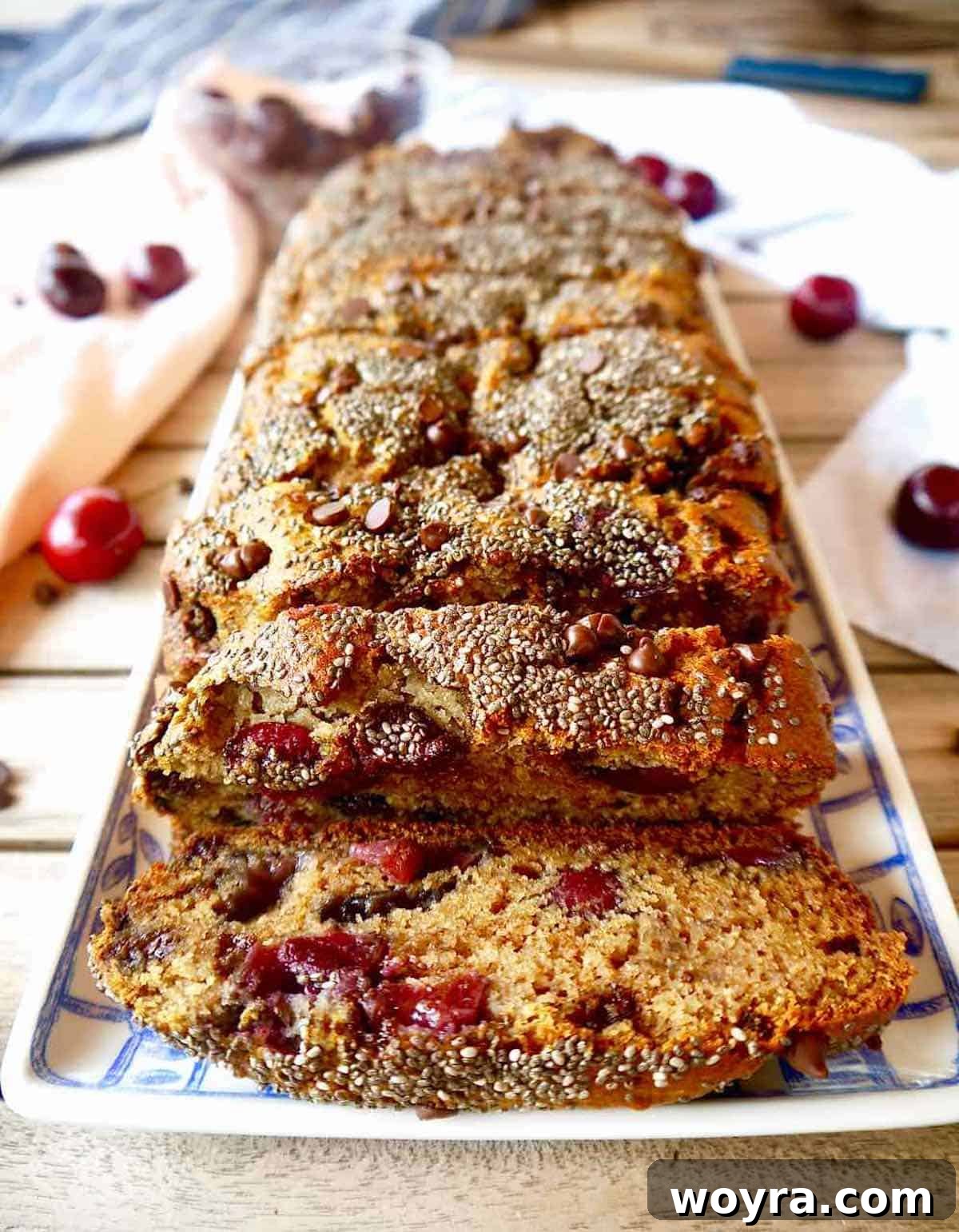 Wholesome Paleo Gluten Free Dairy Free Cherry Banana Bread 5 Freshly baked and sliced Paleo cherry banana bread, showing the moist texture and inclusions.