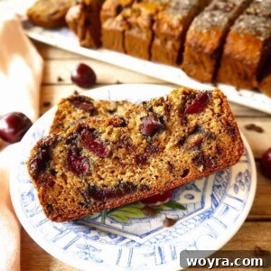 Gluten Free Cherry Banana bread with chocolate chips on a plate.