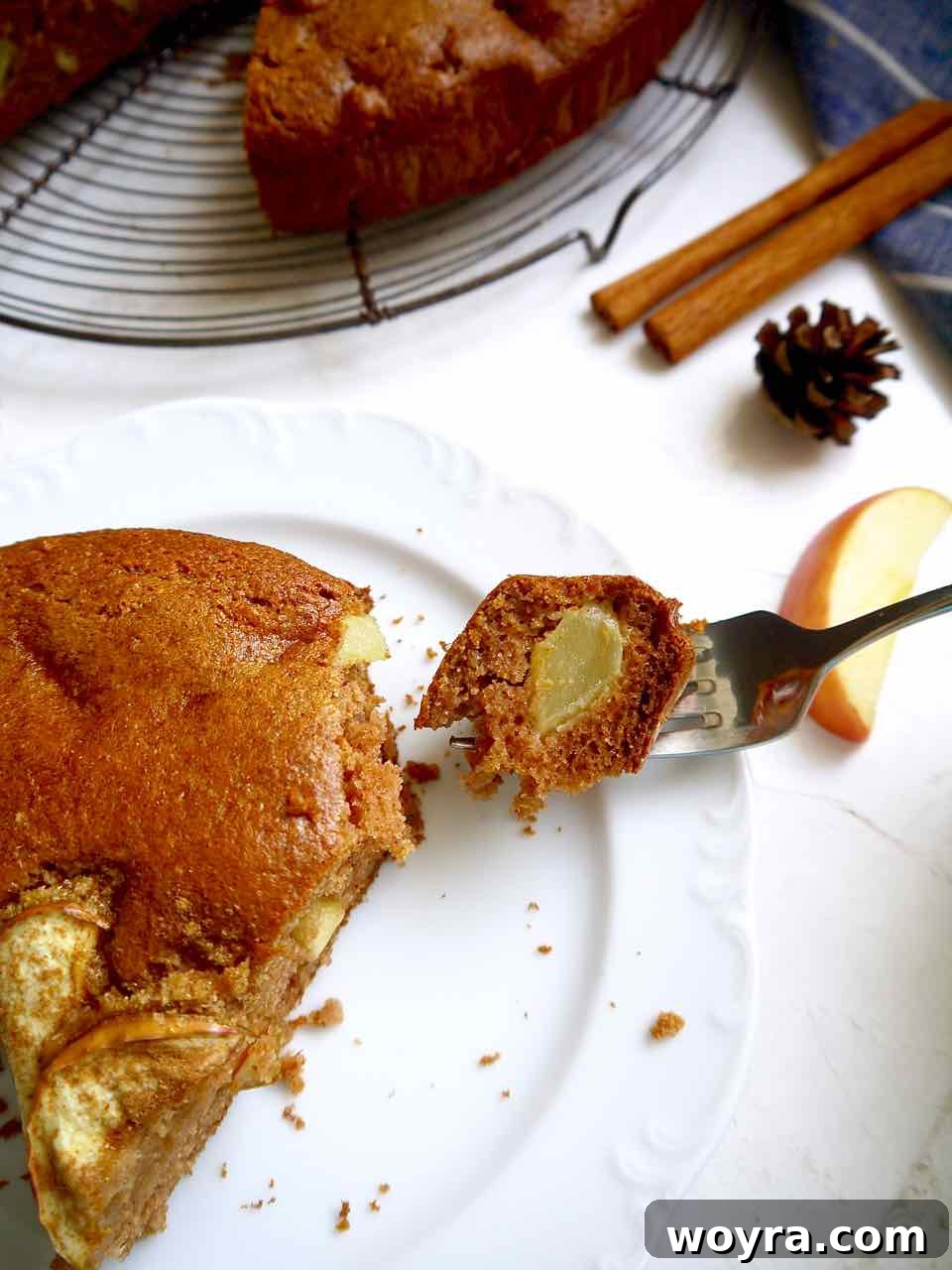 Paleo Apple Almond Cake 8 A plate with a bite of healthy gluten-free apple cake.