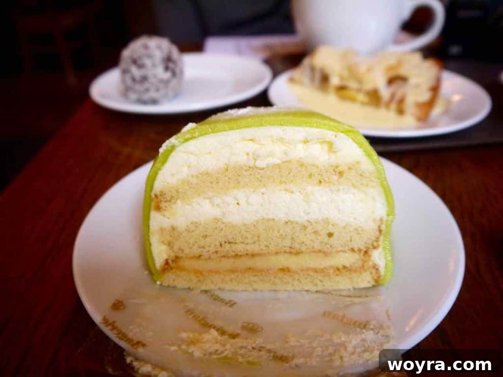 Stockholm The Endless Summer of Sweden 24 A slice of traditional Swedish Princess Cake with green marzipan and pink flower.