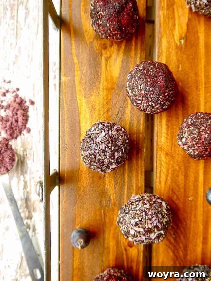 Paleo Vegan Blueberry Date Power Bites 3 Close-up of a stack of Blueberry Date Energy Balls.