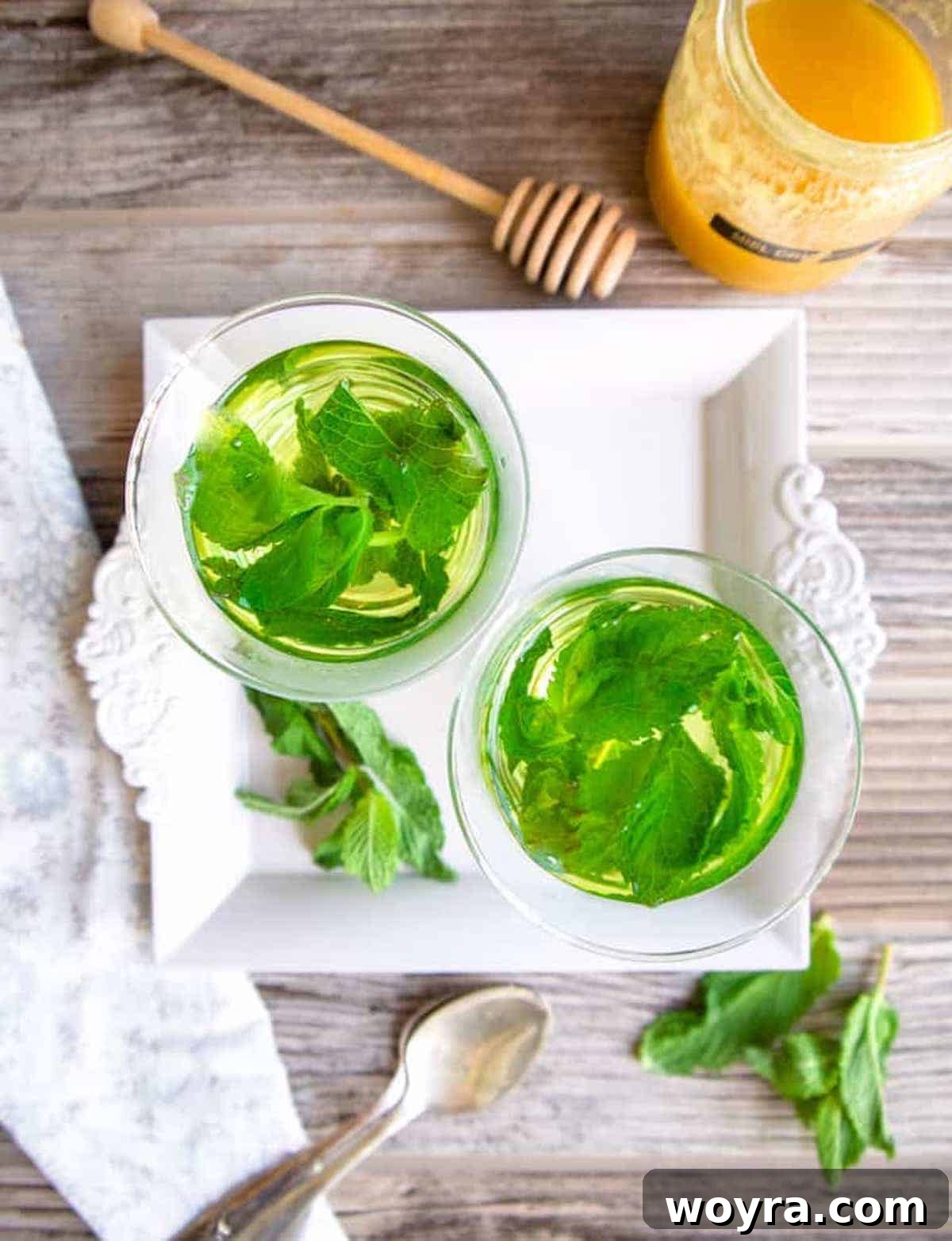 Minty Refreshment Brewed Simple 7 Two cups with mint tea leaves inside.