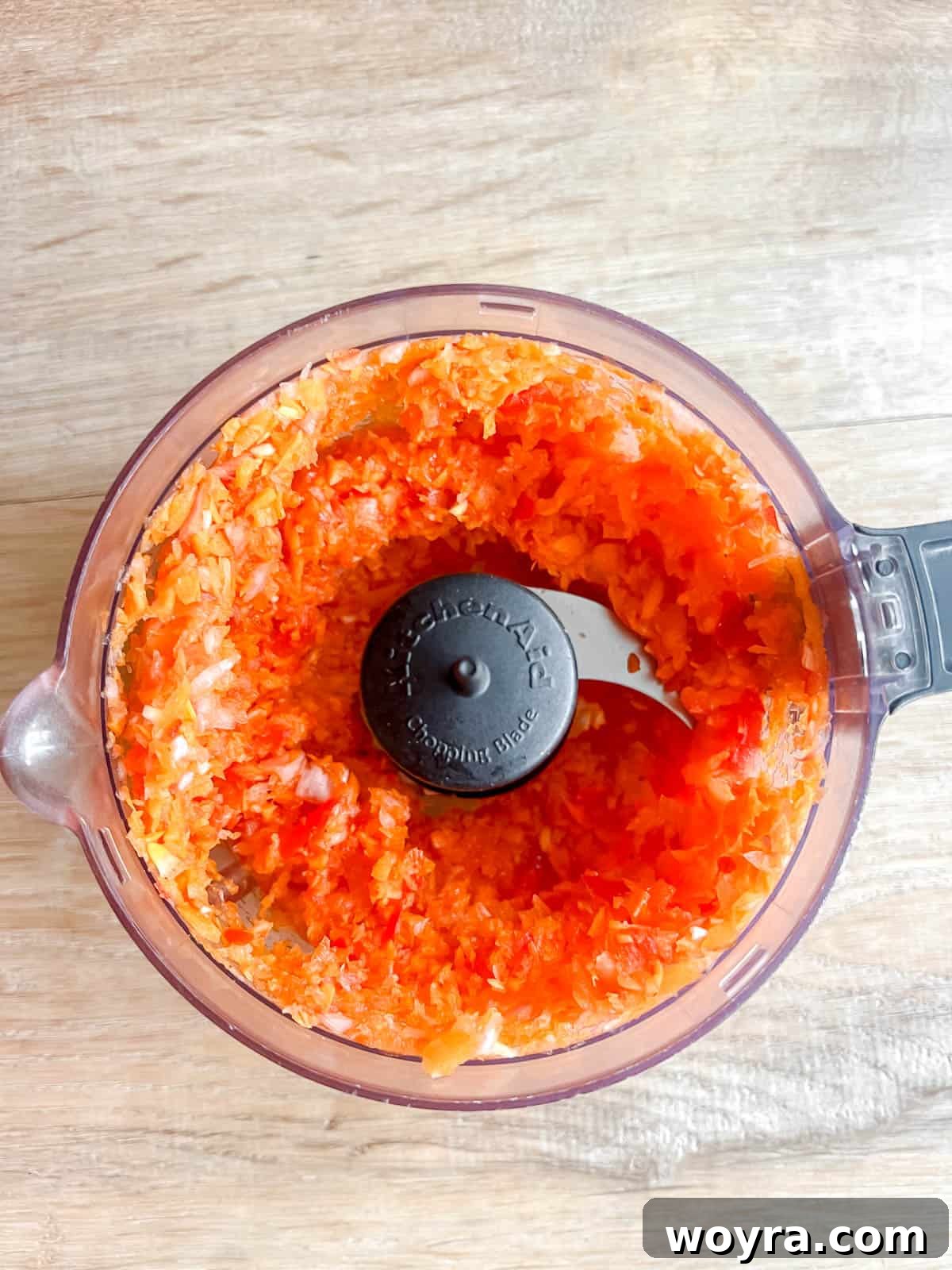 Clean Paleo Meatloaf 7 Minced carrots, onion, garlic, and red pepper in a food processor.