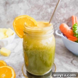 Tropical Kale Carrot Orange Juice in a glass, ready to drink.