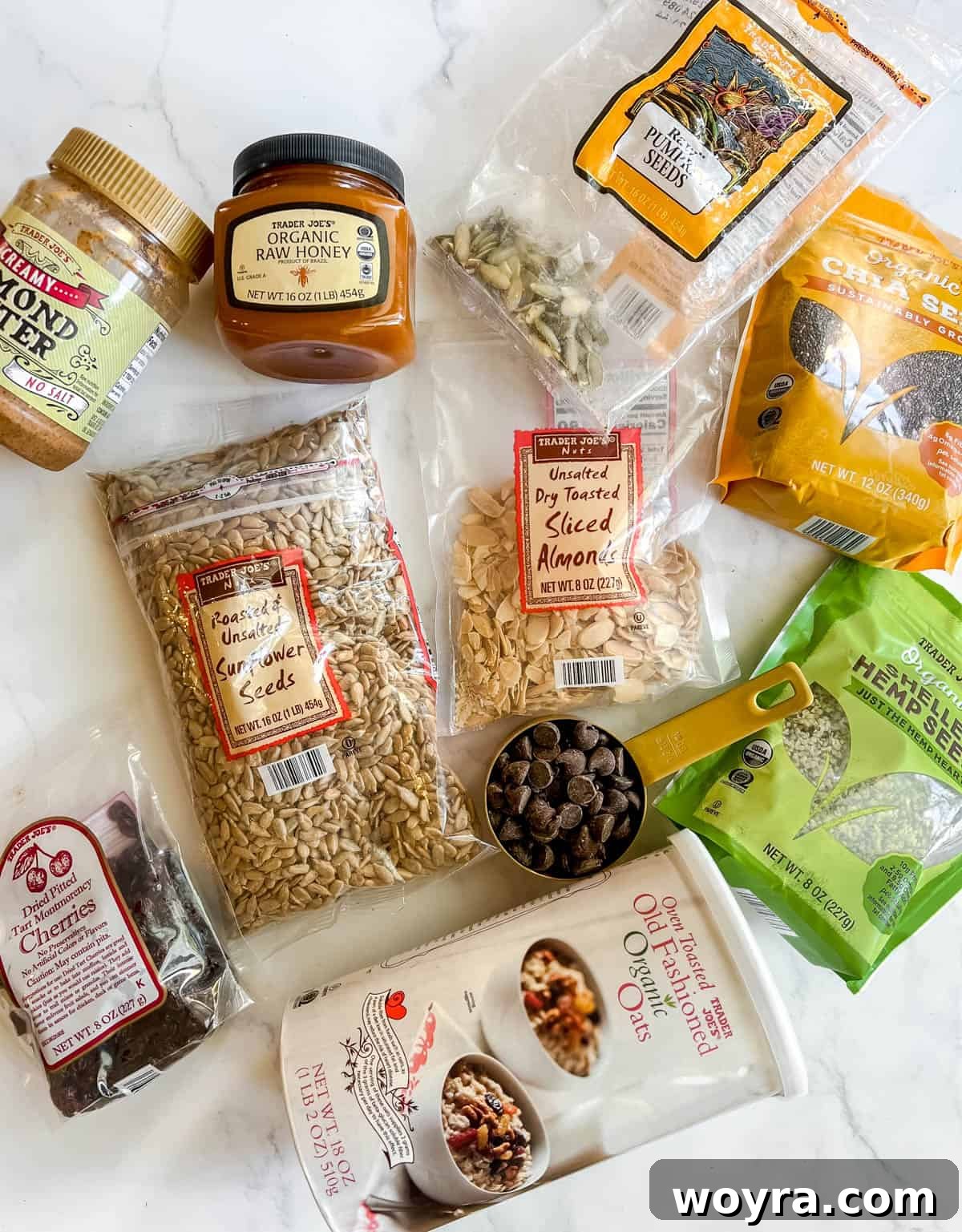 Assortment of dry ingredients and wet ingredients laid out for making no bake gluten free granola bars.