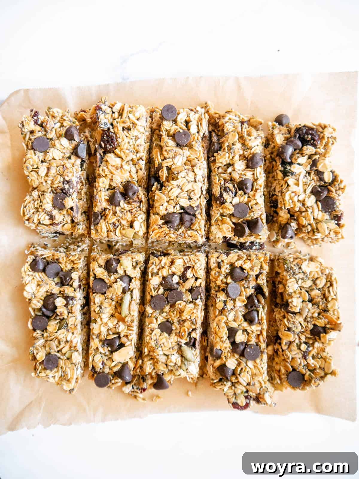 Freshly cut homemade granola bars arranged in uniform rectangular shapes.