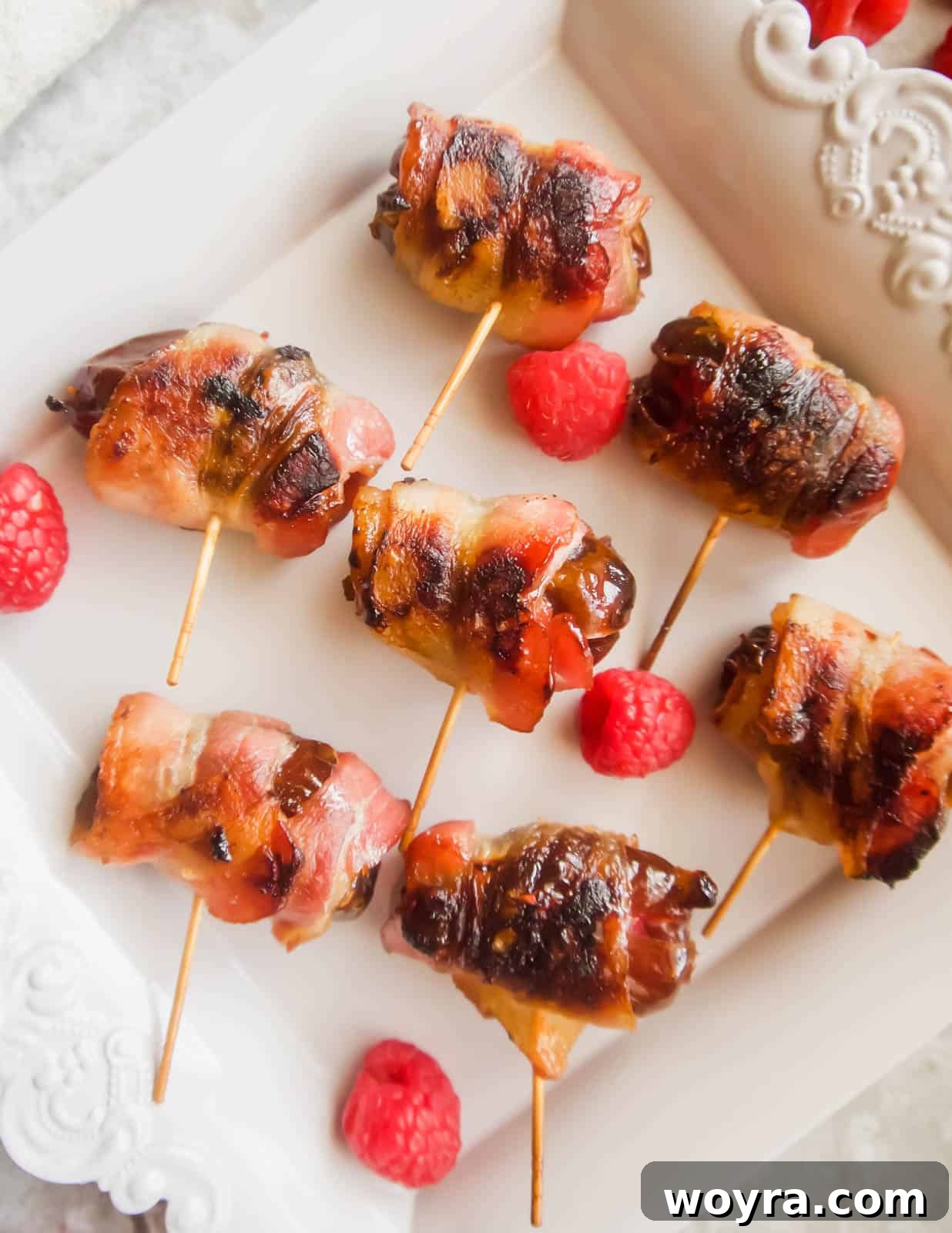 Crispy Bacon-Wrapped Raspberry Stuffed Dates 8 Freshly cooked raspberry stuffed dates wrapped in crispy bacon.