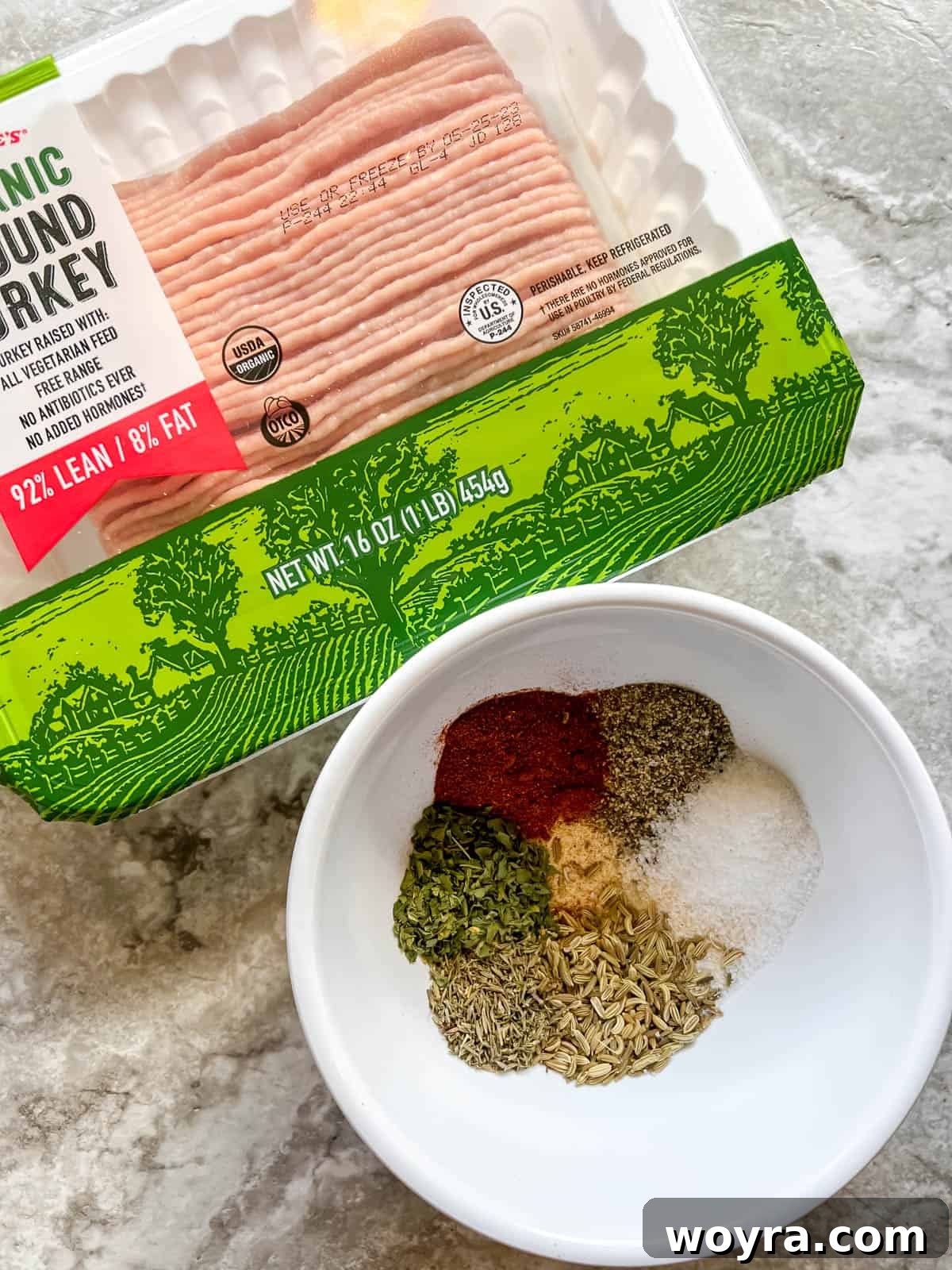 Clean Turkey Sausage Patties (Paleo and Whole30) 3 All the fresh ingredients laid out before making healthy turkey sausage patties, including ground turkey and various spices.
