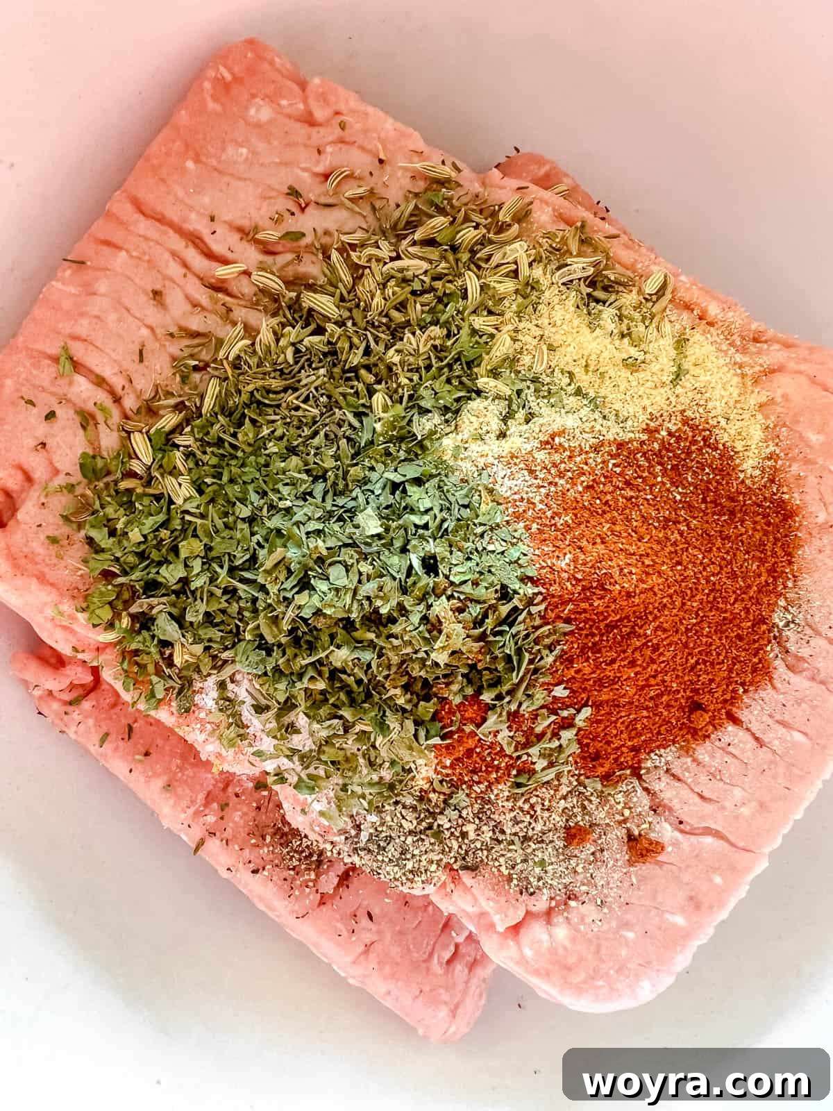 Clean Turkey Sausage Patties (Paleo and Whole30) 4 All the ingredients for turkey sausage patties in a mixing bowl before combining.