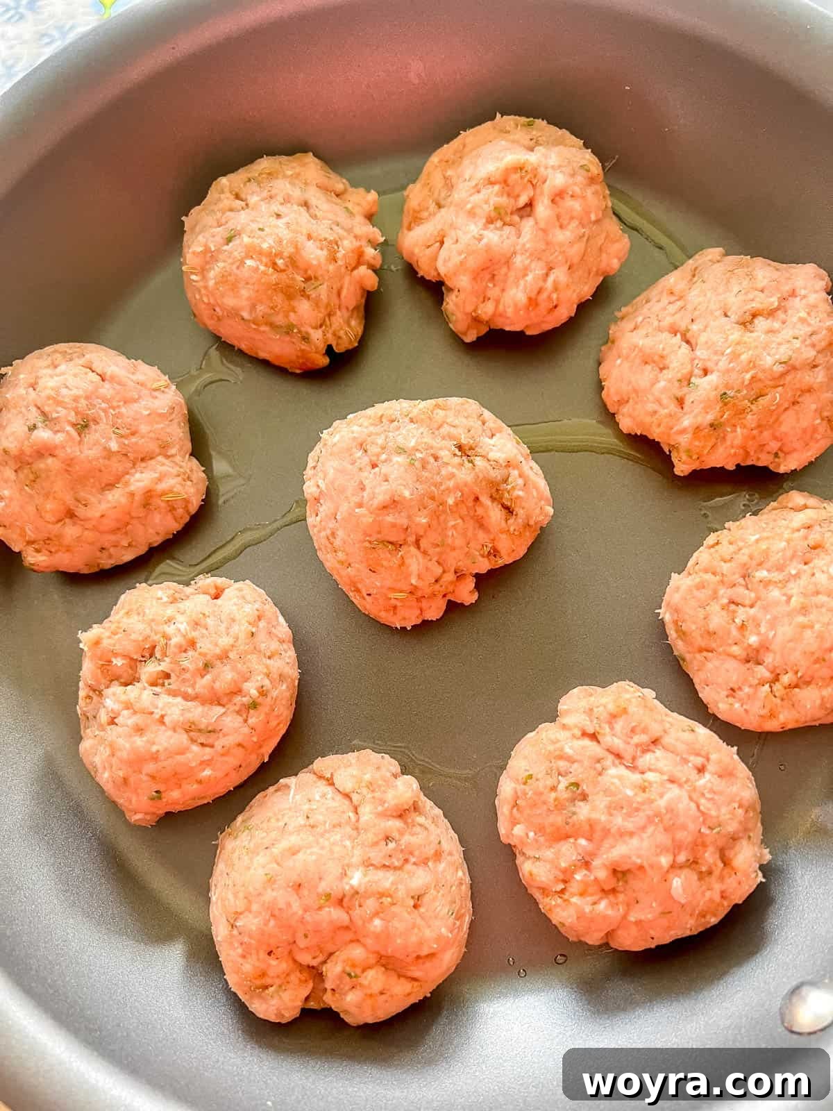 Clean Turkey Sausage Patties (Paleo and Whole30) 5 Turkey sausage patties formed and ready for cooking in a pan.