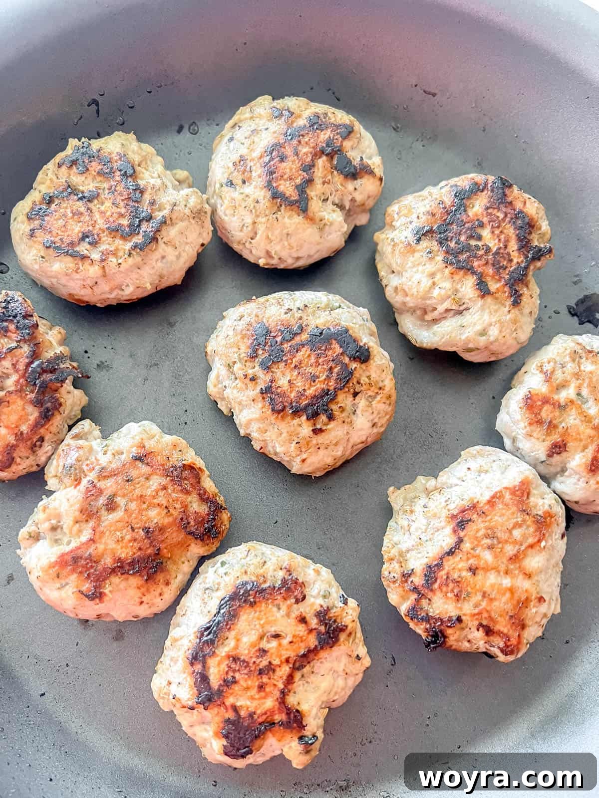 Clean Turkey Sausage Patties (Paleo and Whole30) 6 Sausage patties perfectly cooked and browned in a pan.