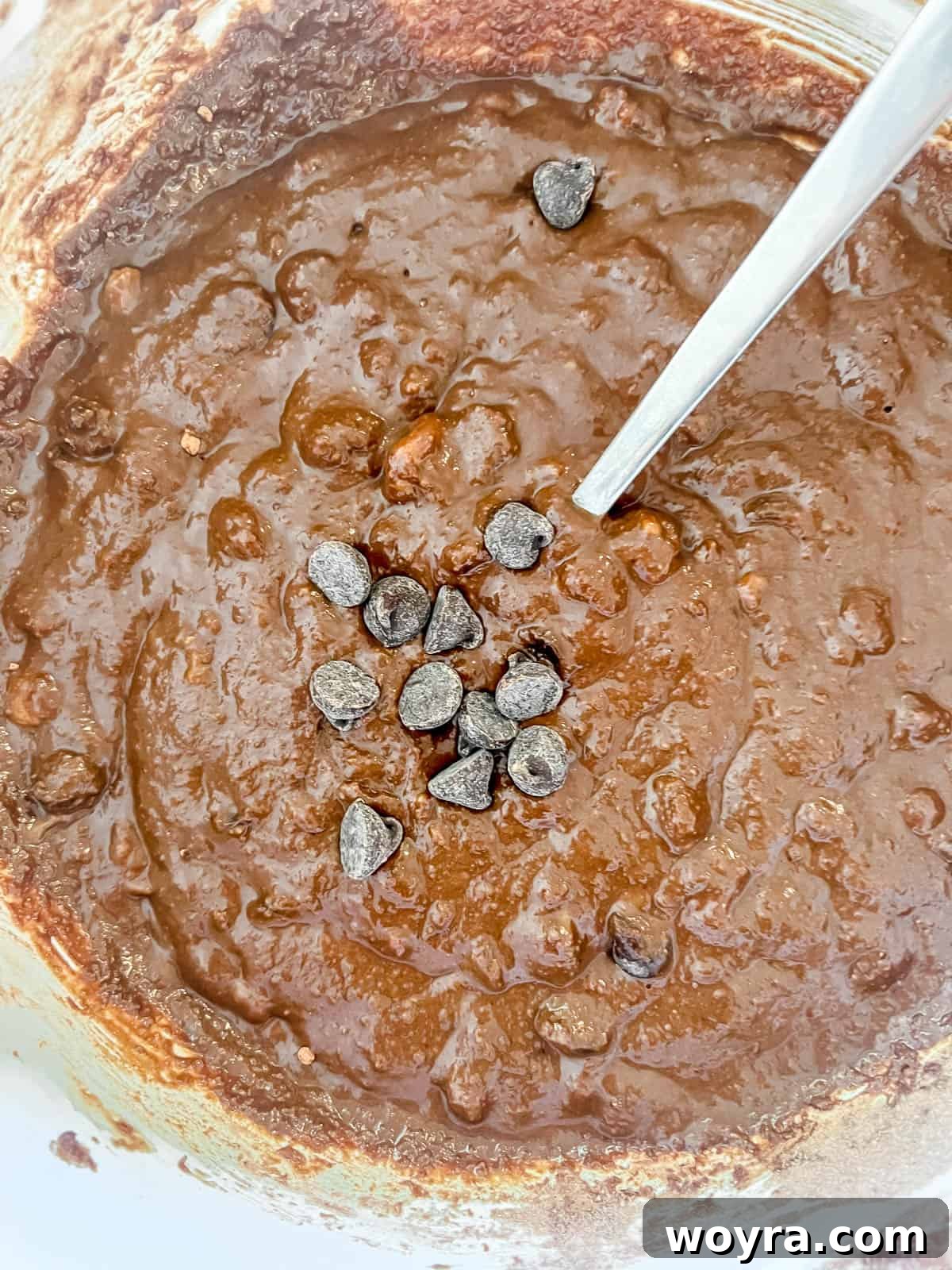 Decadent Paleo Chocolate Muffins 8 Chocolate chips gently folded into the chocolate muffin batter.