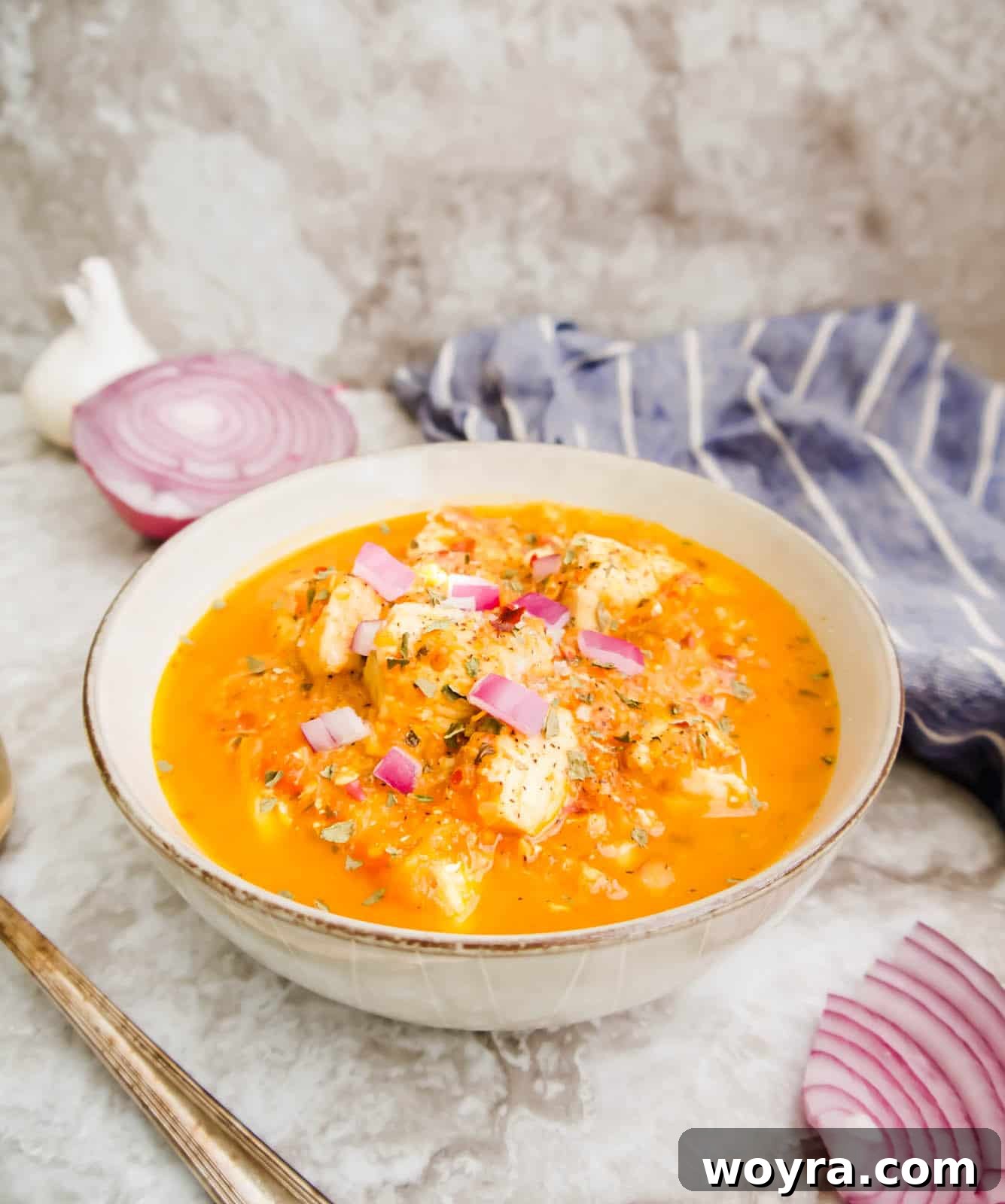 Chicken with Burst Cherry Tomatoes 3 Cherry tomato sauce with chicken in it in a bowl.