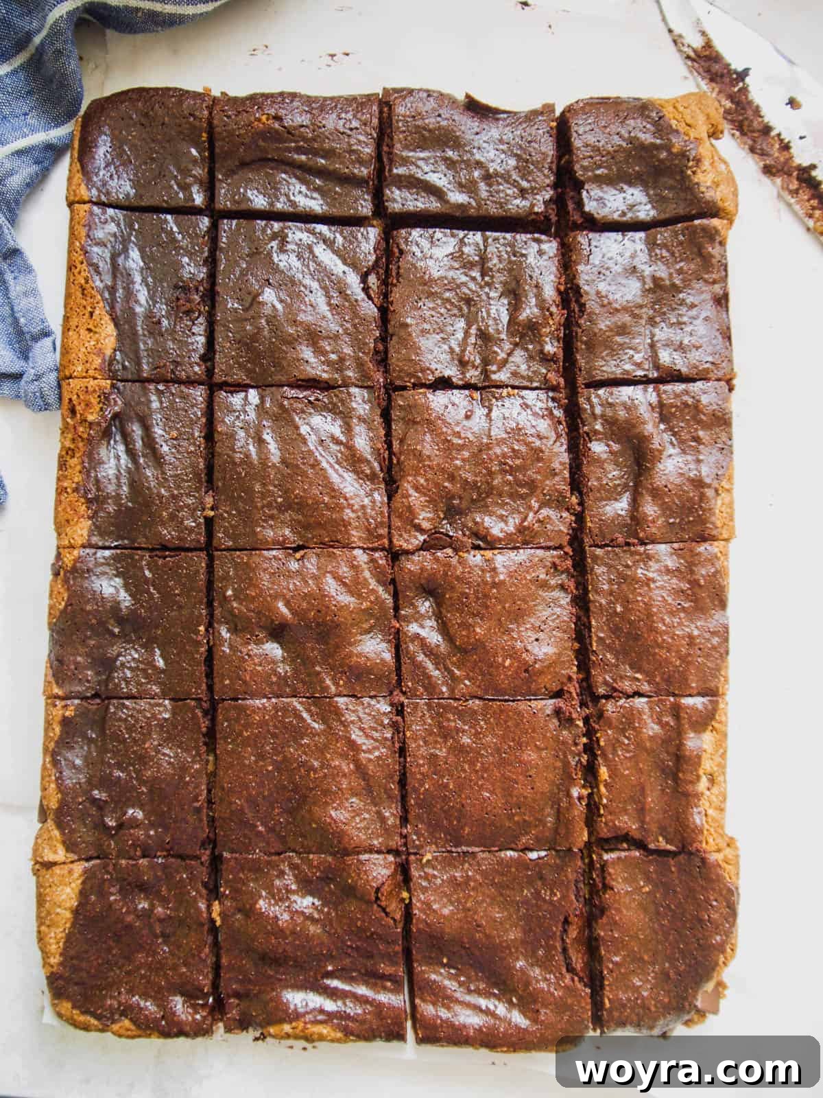 The paleo brownie cookie bars neatly cut into perfect cubes, ready to serve.