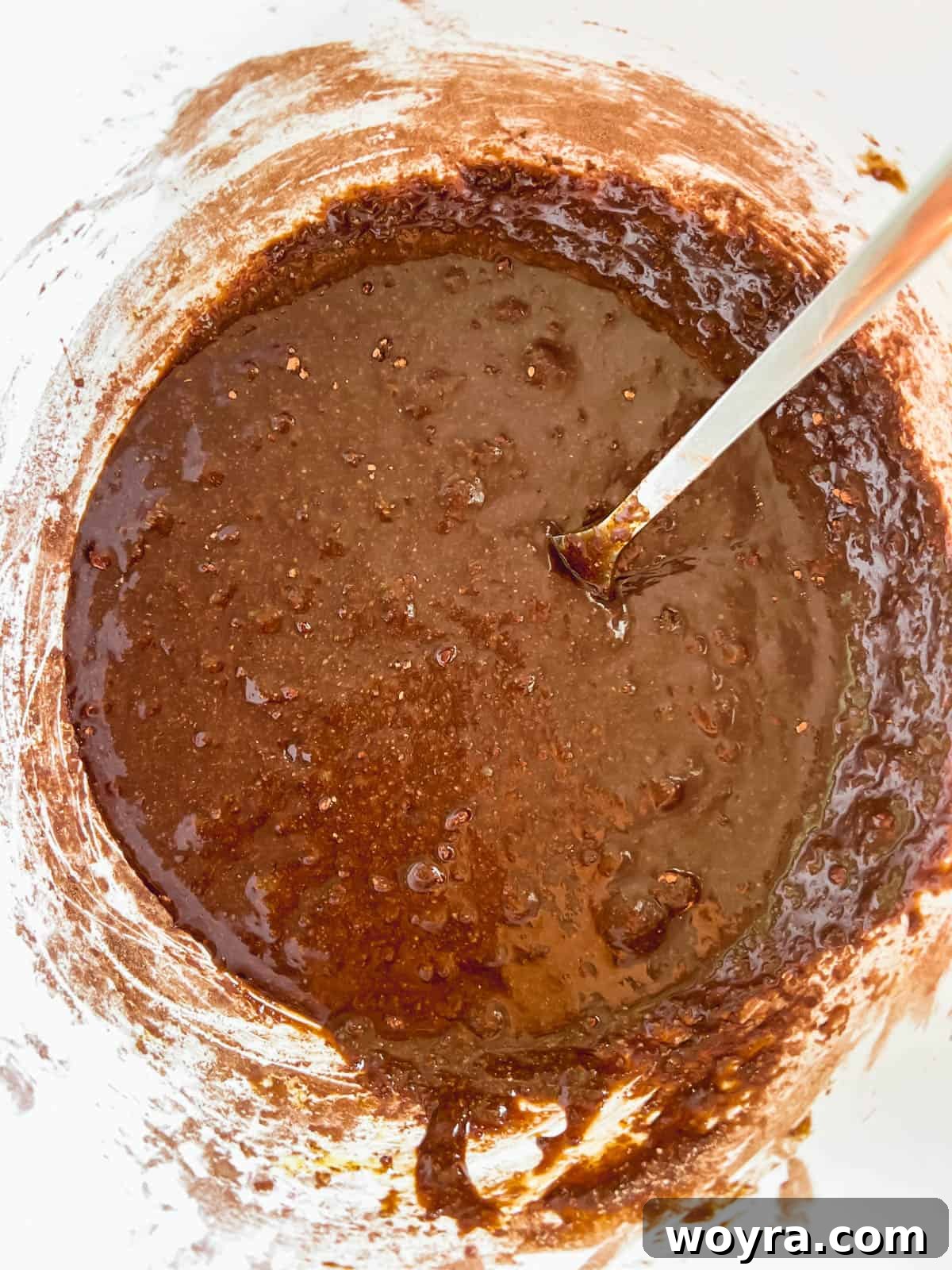 The rich, dark brownie batter ready for the next layer.