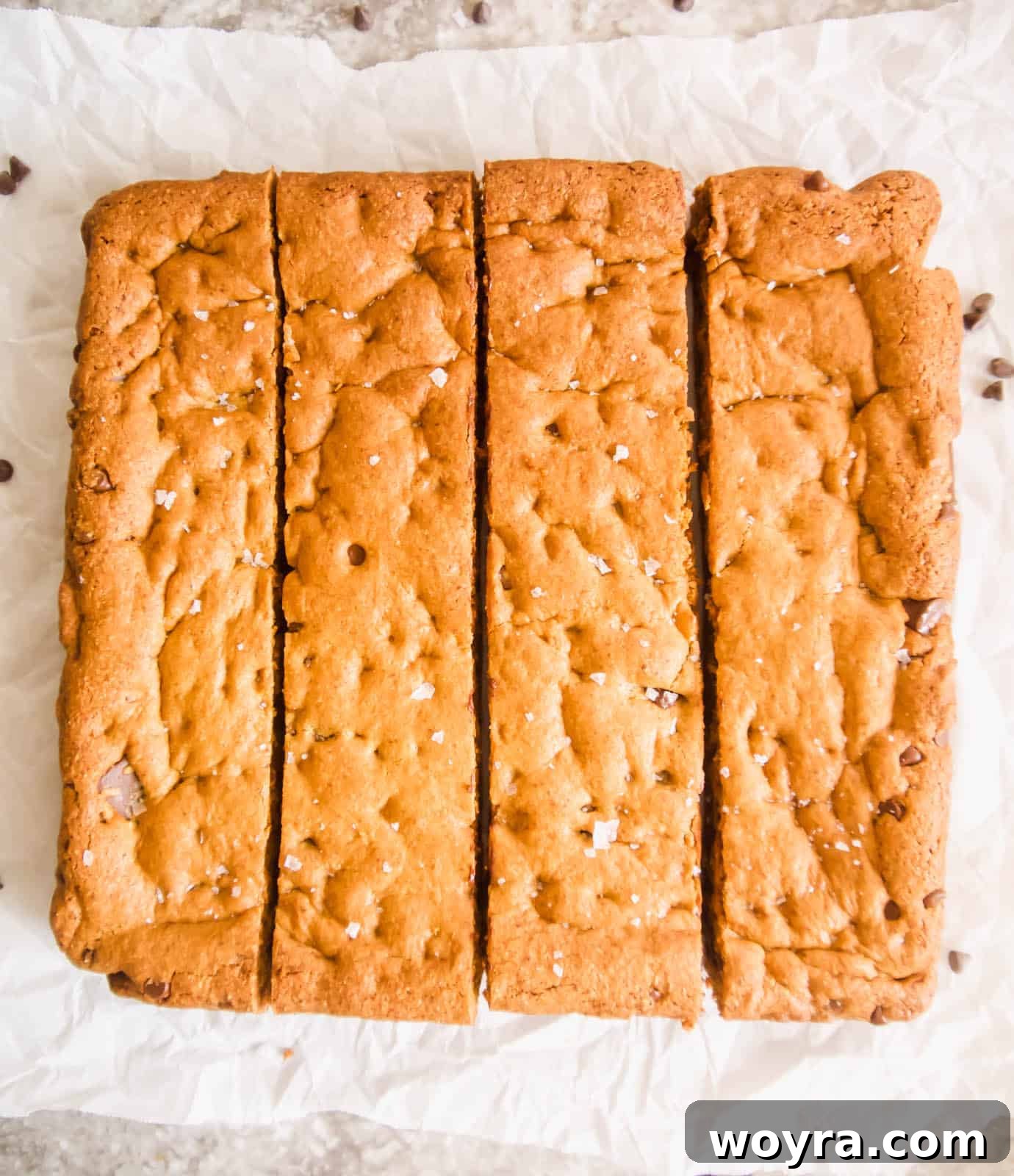 Paleo cookie bars freshly baked and cooling in a pan.