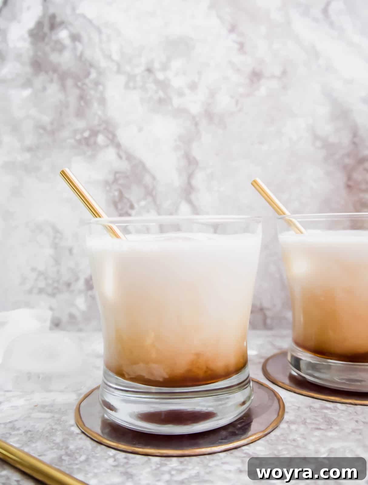 Vegan Velvet Russian 5 Two perfectly prepared cups of white russian, invitingly ready to be enjoyed.