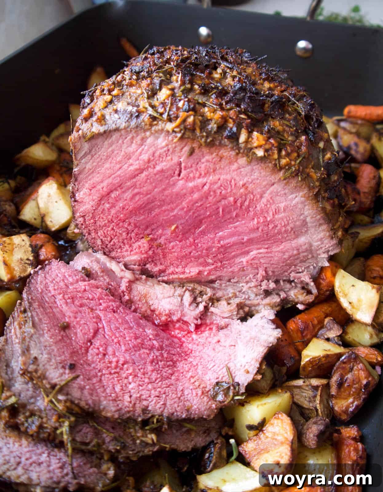 Garlic Herb Beef Heart of Shoulder Roast 8 Expertly sliced beef shoulder roast, revealing a perfectly cooked, juicy interior.