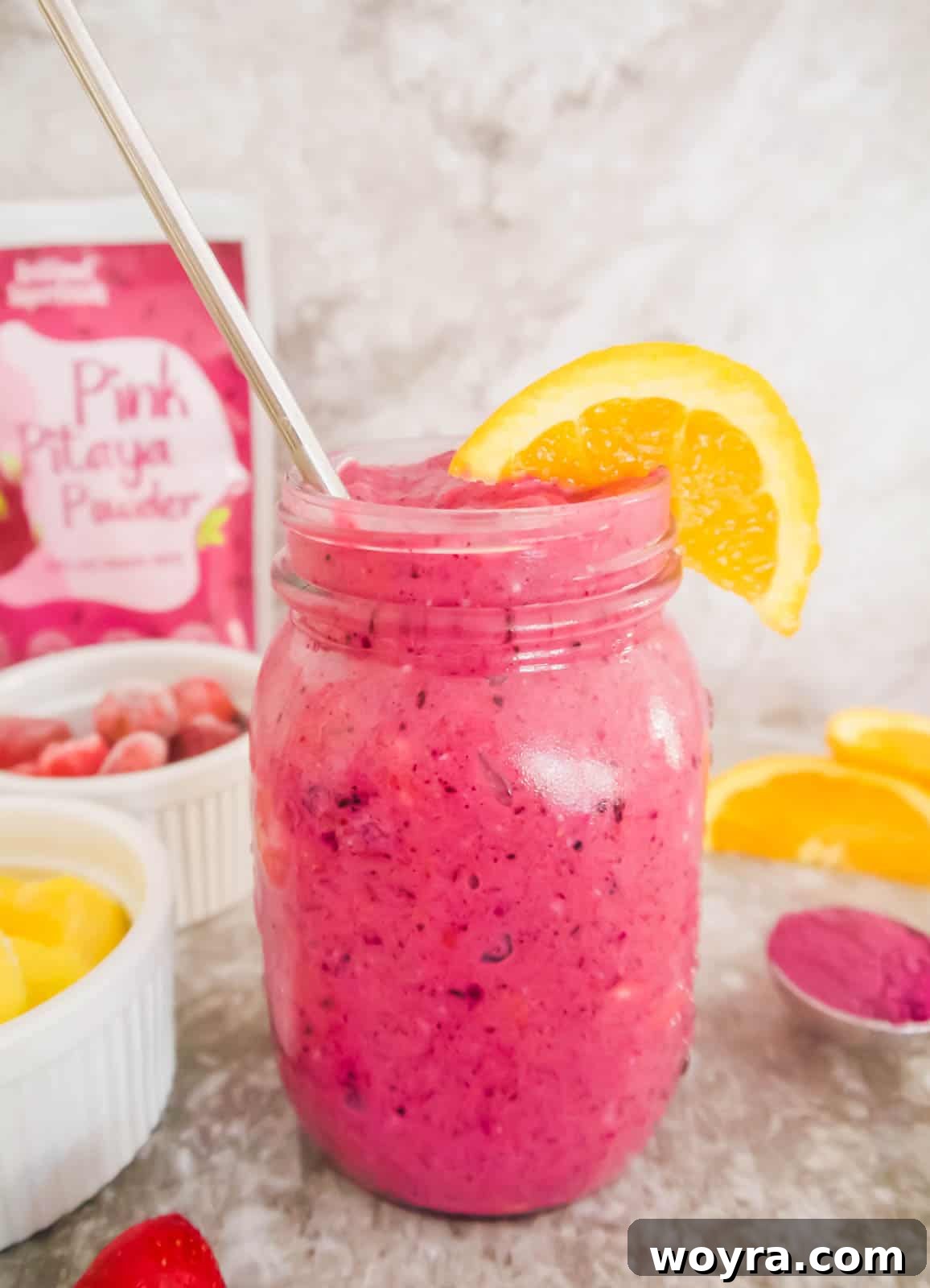 Tropical Pitaya Mango Berry Blend 5 Freshly blended Dragon Fruit Powder Mango Berry Smoothie poured into a mason jar, showcasing its smooth texture and rich pink color.