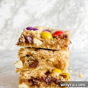 Gluten Free Cookie Bars stacked on top of each other, featuring a close-up of the delicious texture.