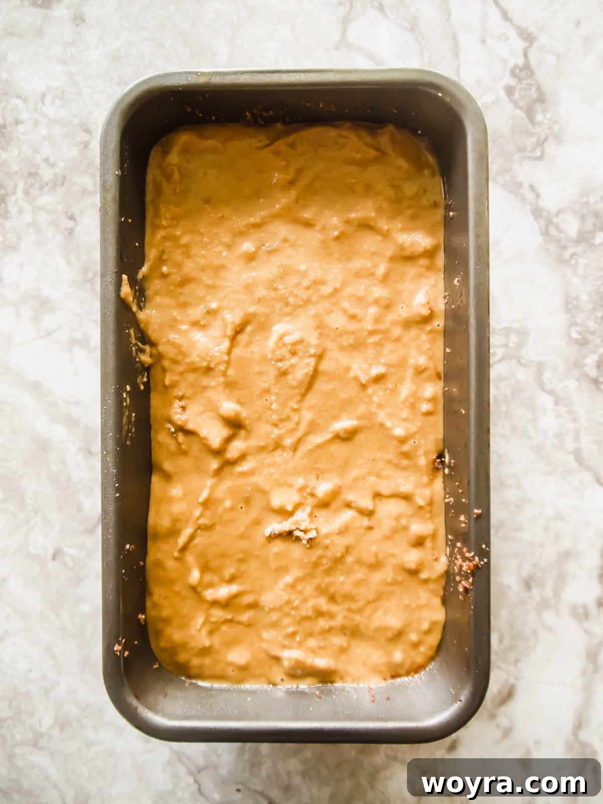 Gluten-free banana bread with streusel layered before baking.