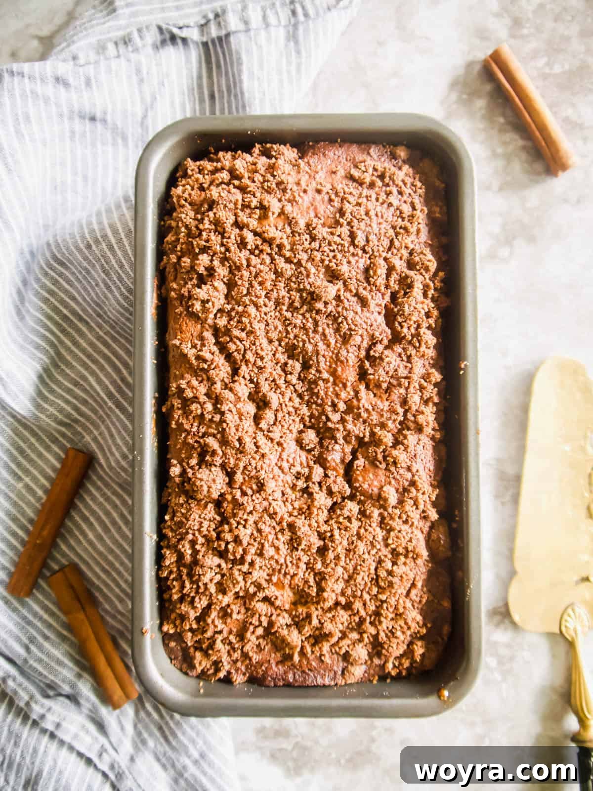 A freshly baked, golden brown coffee cake banana bread loaf after baking, still warm.