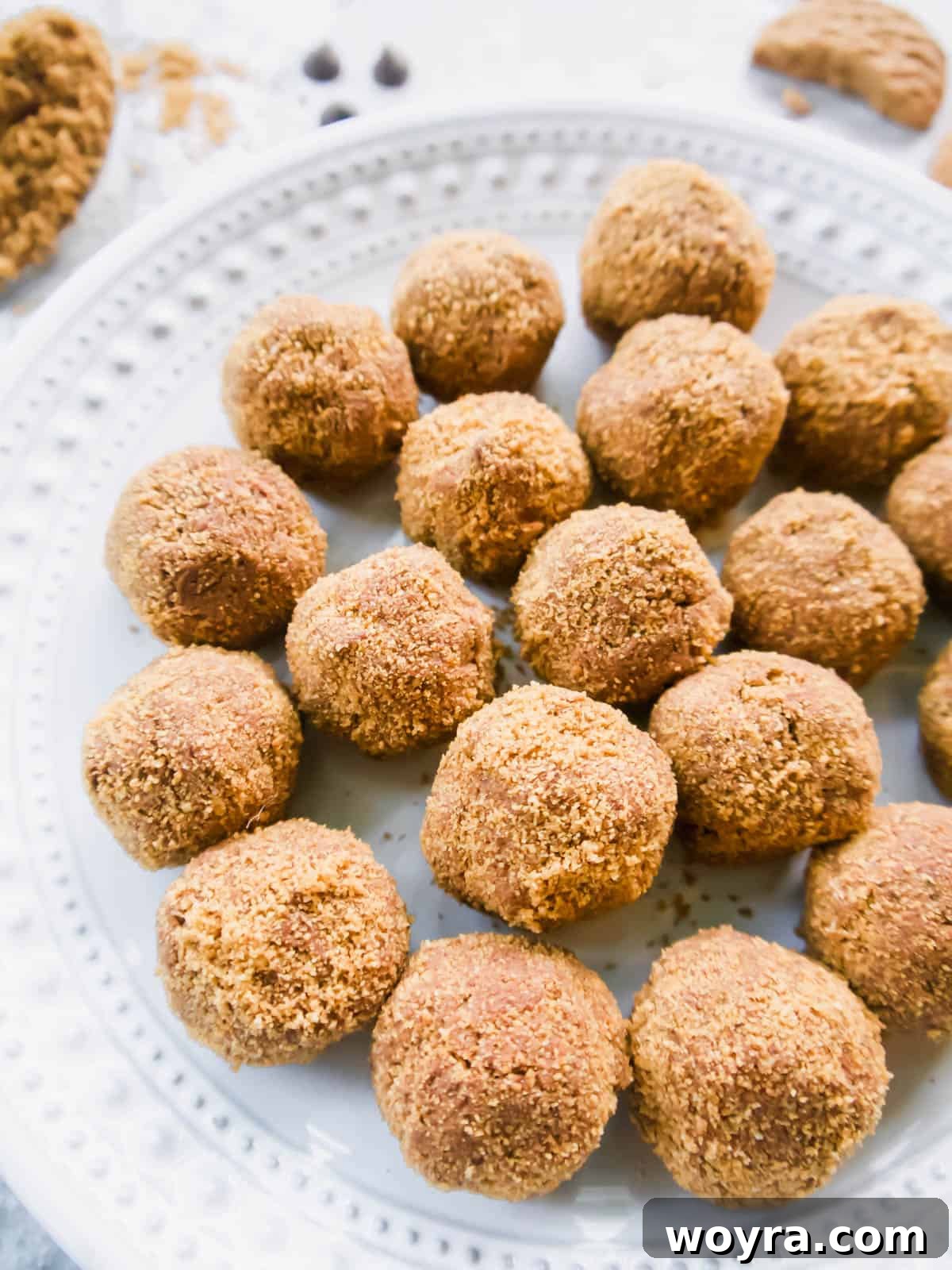 Velvety Chocolate Mousse Treats Dairy Free Gluten Free 4 A close-up side angle of several beautifully crafted dairy-free chocolate mousse balls arranged on a white plate.