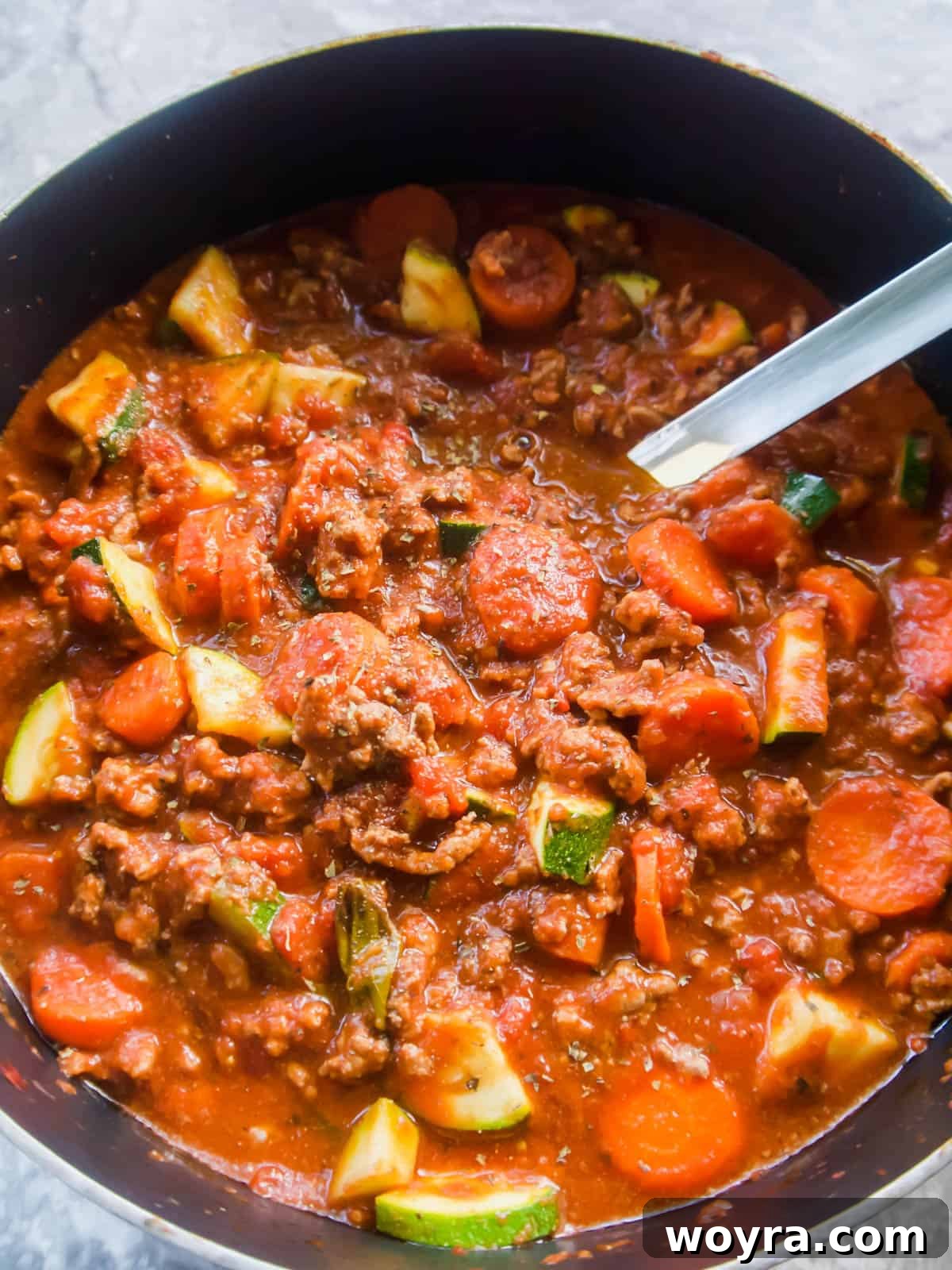 Wholesome Meat Sauce Packed with Zucchini and Carrots 4 Close-up of paleo veggie meat sauce in a pot, showcasing its rich texture and colorful vegetables simmered to perfection.