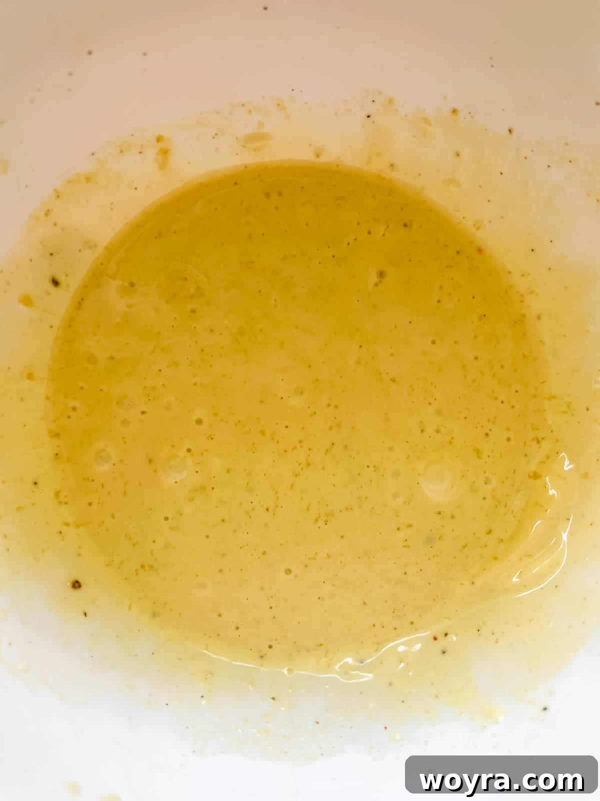 The dressing mixed together in a bowl.