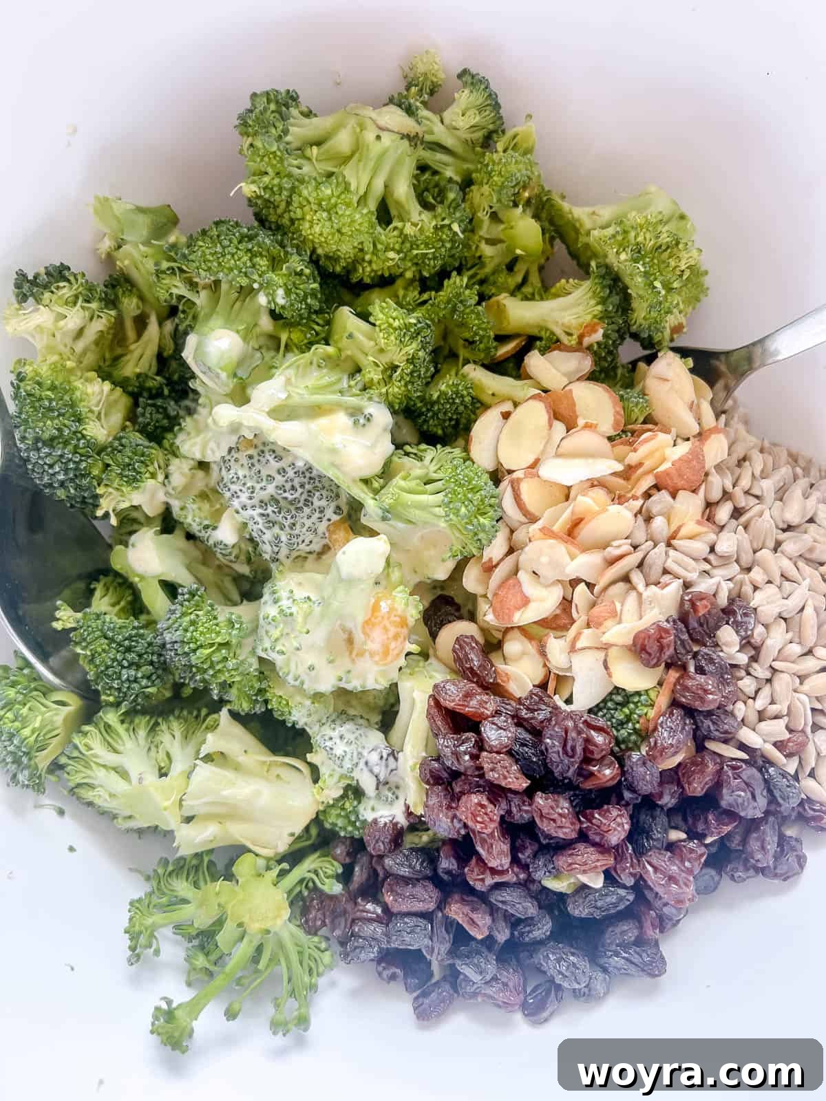 The dressing added to the bowl.