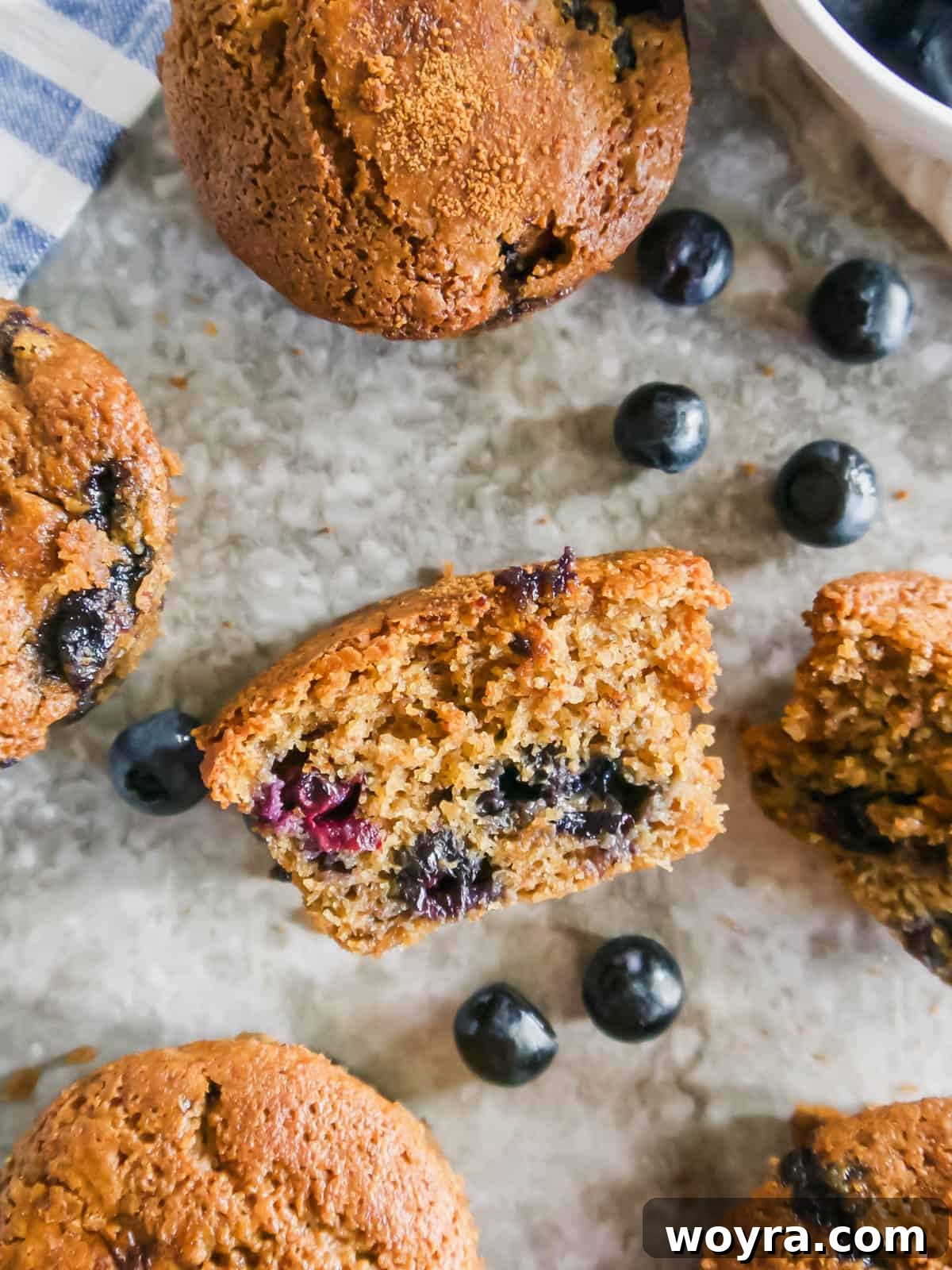 Grain-Free Blueberry Bliss Muffins 3 A perfectly sliced gluten-free and dairy-free blueberry muffin, revealing the tender crumb and whole blueberries.