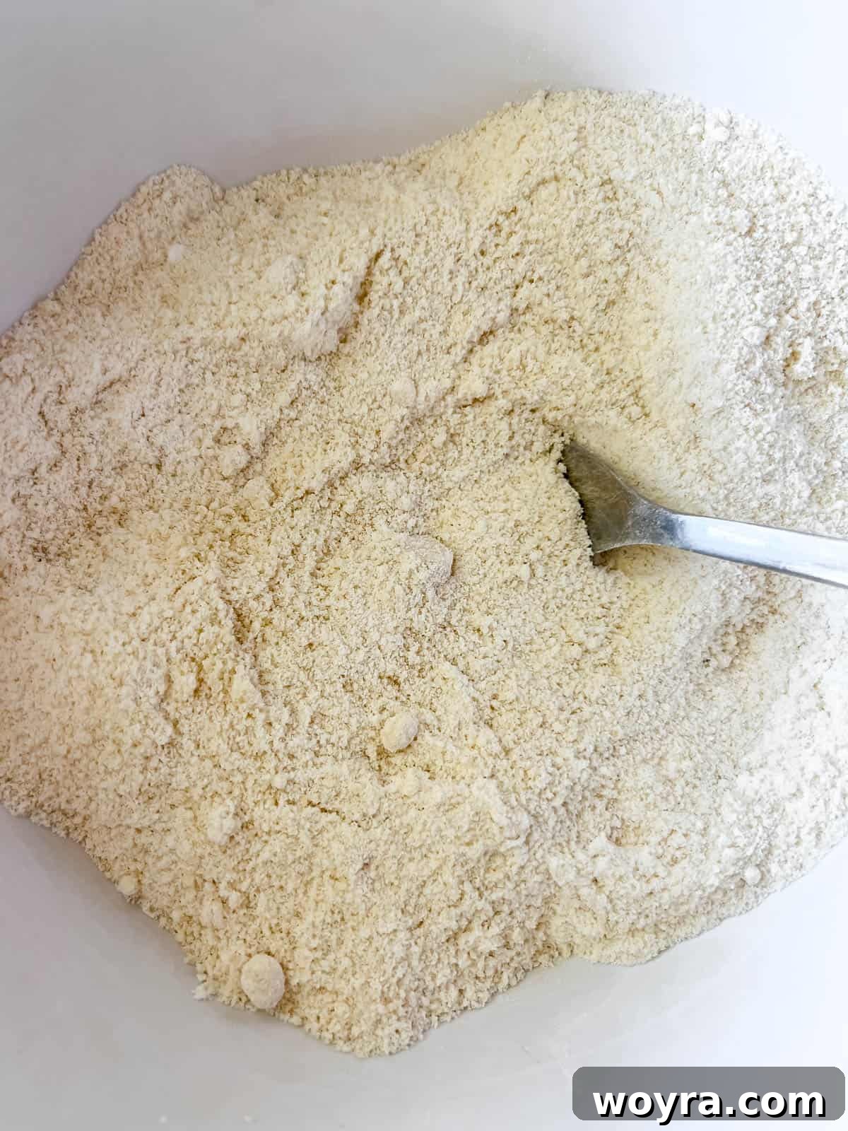Grain-Free Blueberry Bliss Muffins 5 Dry ingredients for Paleo muffins meticulously mixed in a bowl.