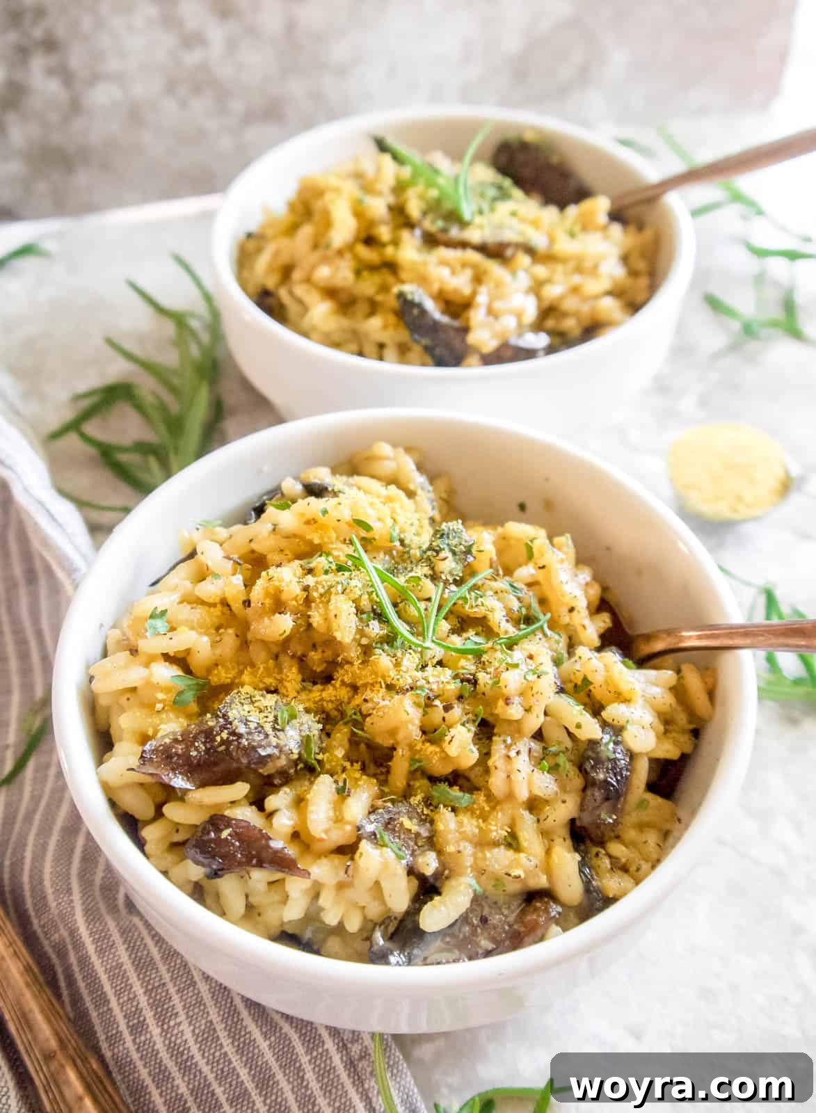 A bowl of creamy risotto topped with nutritional yeast, ready to eat.