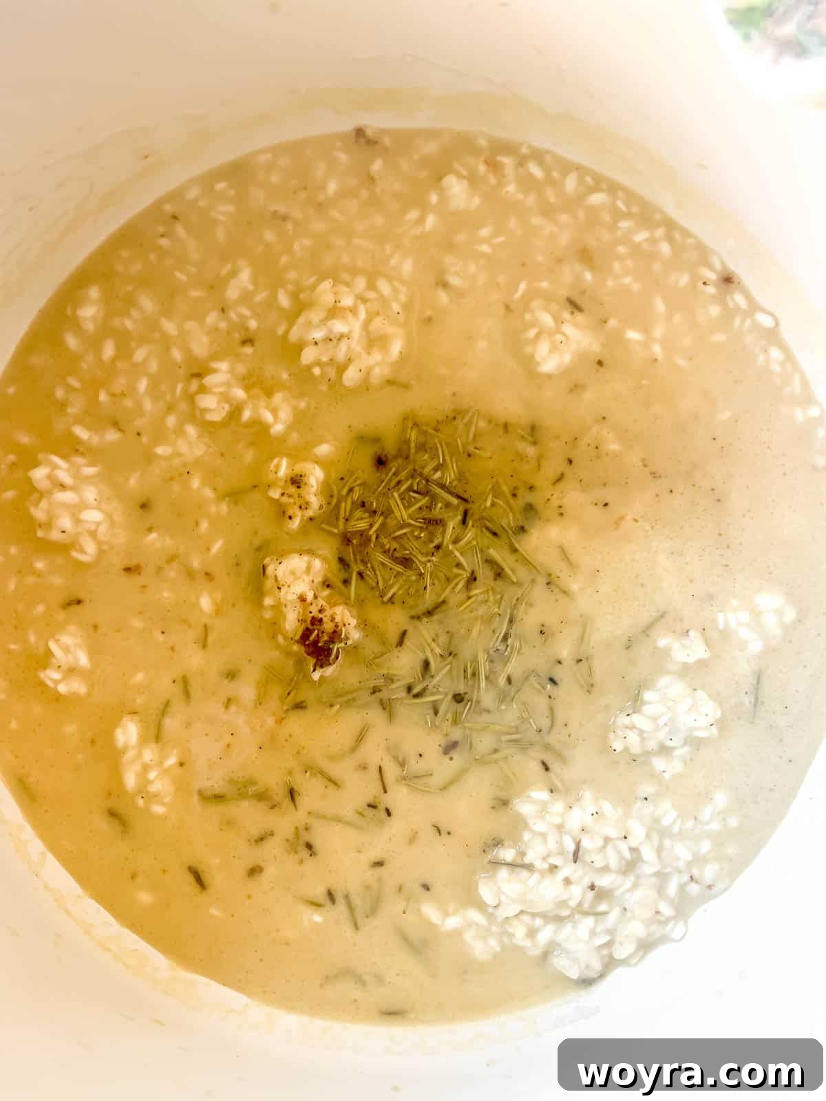 Chicken broth and spices added to the rice.