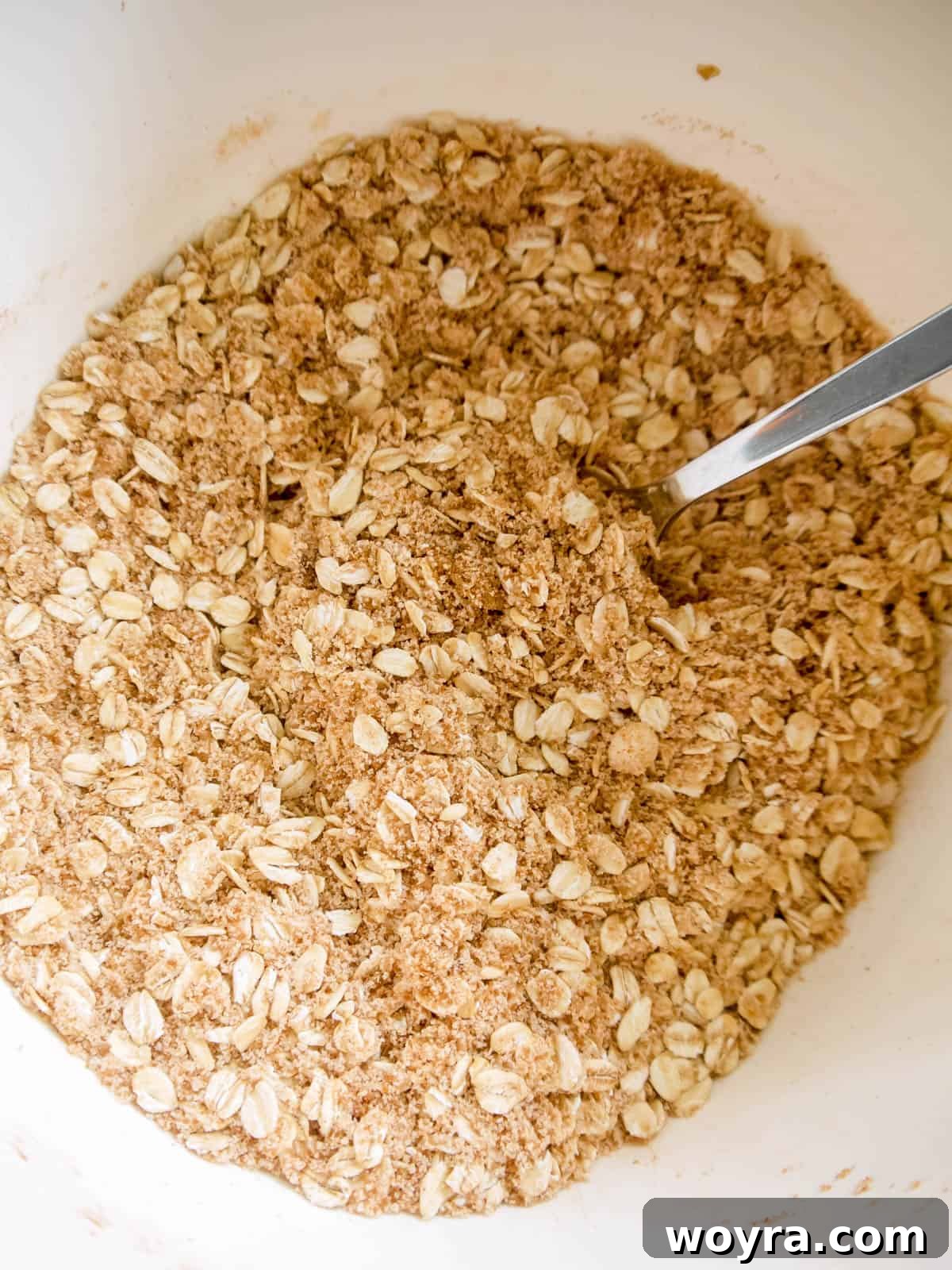 Wholesome Vegan Apple Crisp 6 Almond and oat crisp topping mixed together in a bowl. A bowl of dry ingredients for the streusel topping.