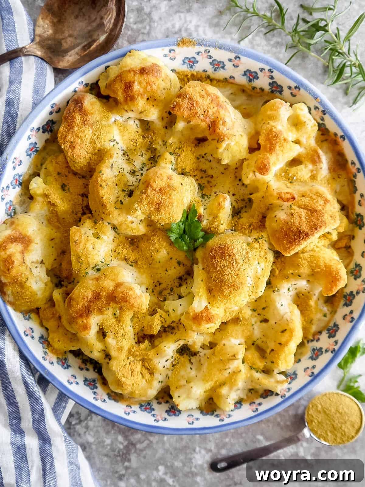 A golden-brown vegan cauliflower au gratin fresh out of the oven, with a crispy top.
