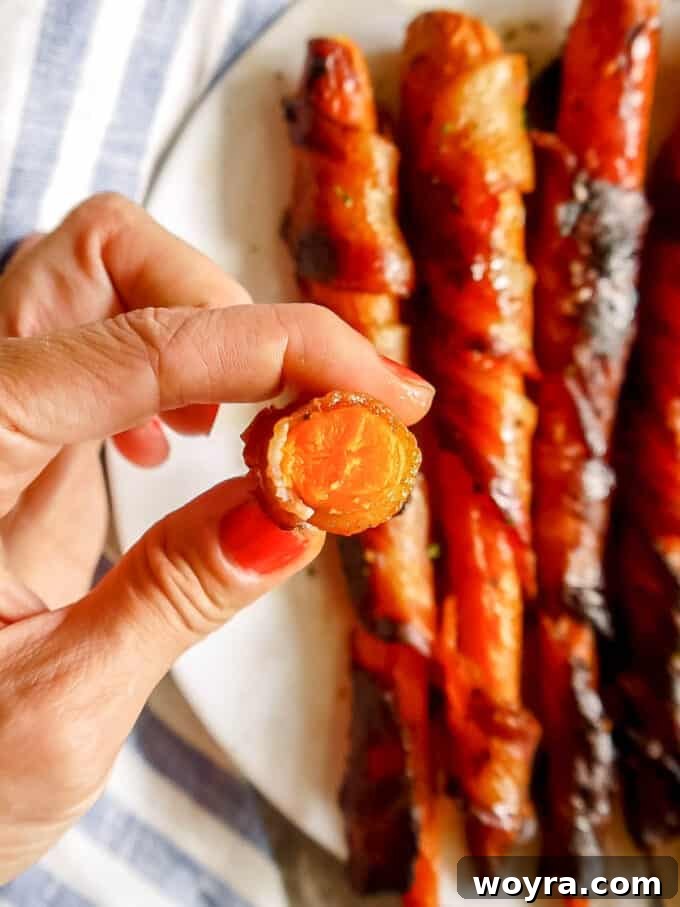 Paleo Gluten Free Maple Bacon Roasted Carrots 8 Golden, crispy Maple Bacon Wrapped Carrots fresh from the oven, glistening with maple glaze.