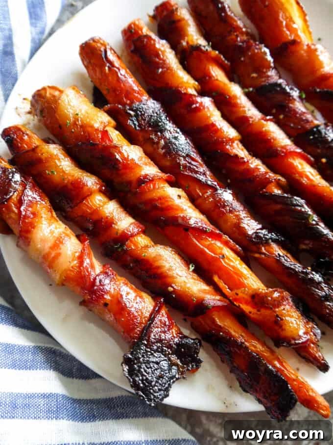 Paleo Gluten Free Maple Bacon Roasted Carrots 9 Elegantly plated Maple Bacon Wrapped Carrots, showcasing the perfect crisp of the bacon.