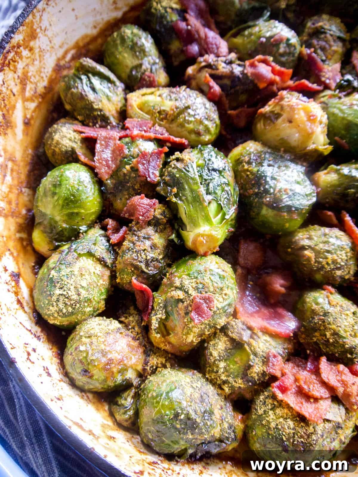 Paleo Whole30 Dairy Free Brussels Sprouts Casserole 11 A savory Whole30 Brussels sprouts casserole, topped with crumbled bacon and a creamy sauce, captured in an oven-safe pan.
